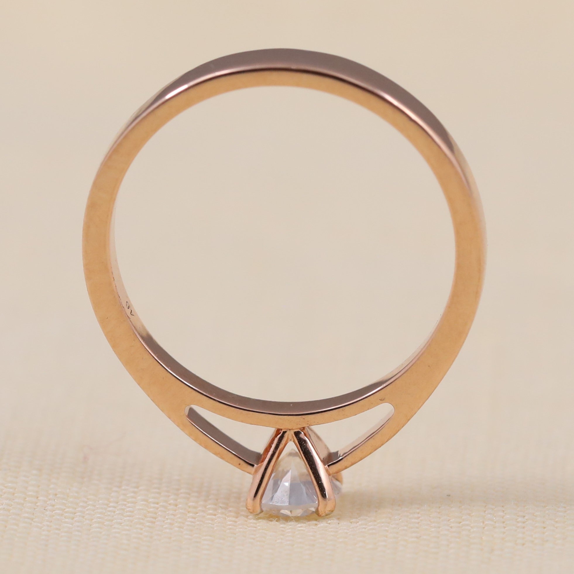 Classic round lab grown diamond engagement ring with a simple polished band
