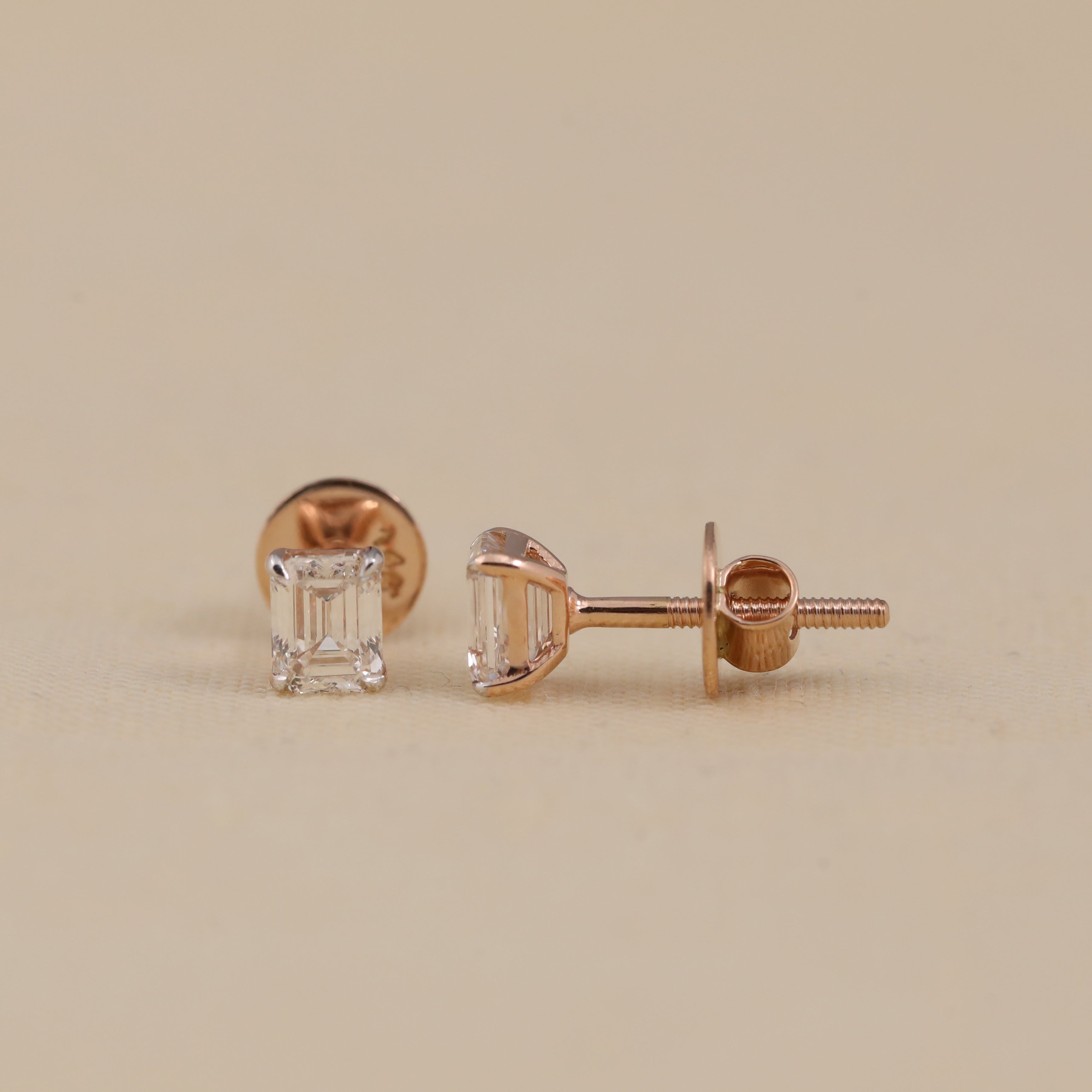 Timeless emerald cut diamond studs suitable for festive and party occasions.