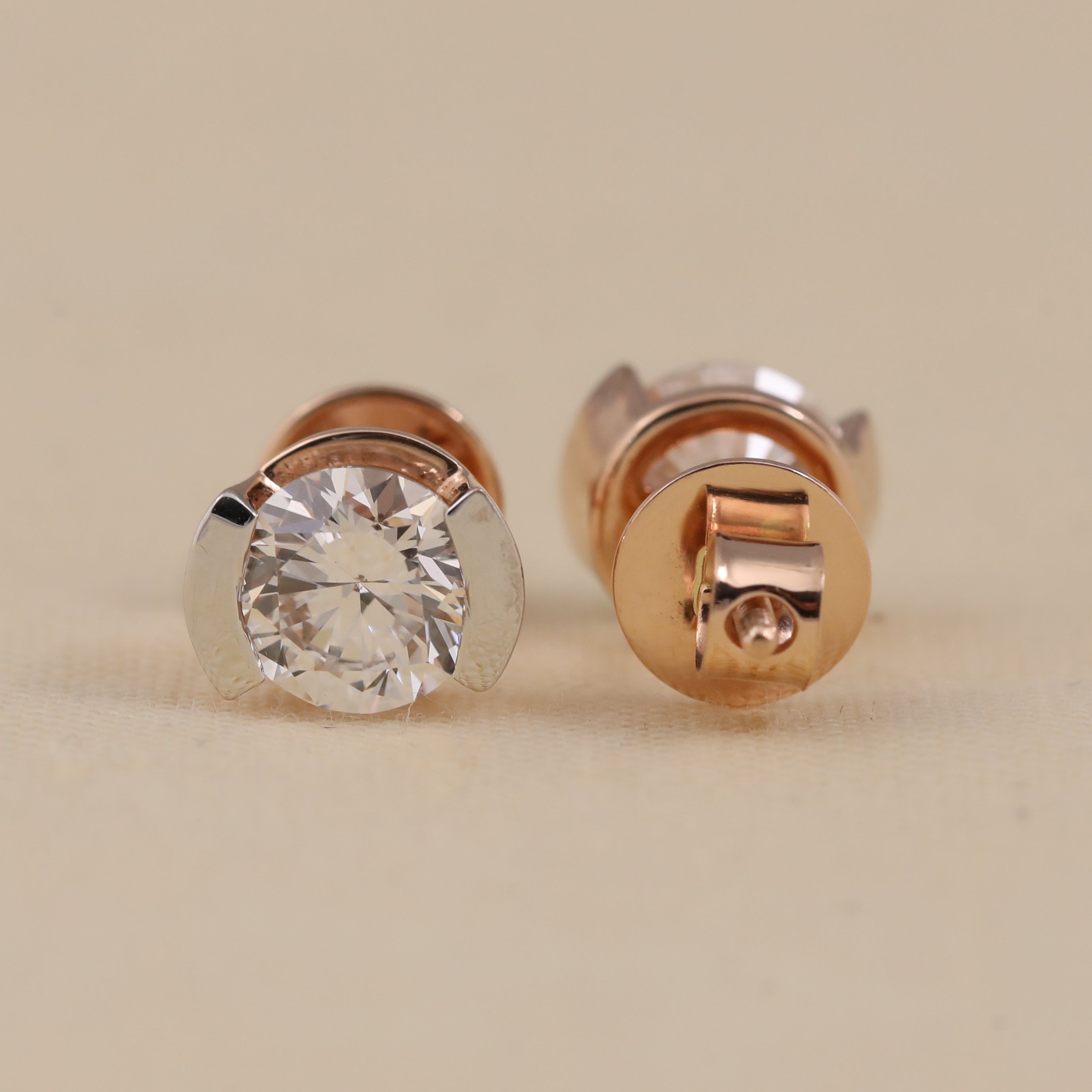 Elegant round half-bezel diamond studs ideal for wedding celebrations.