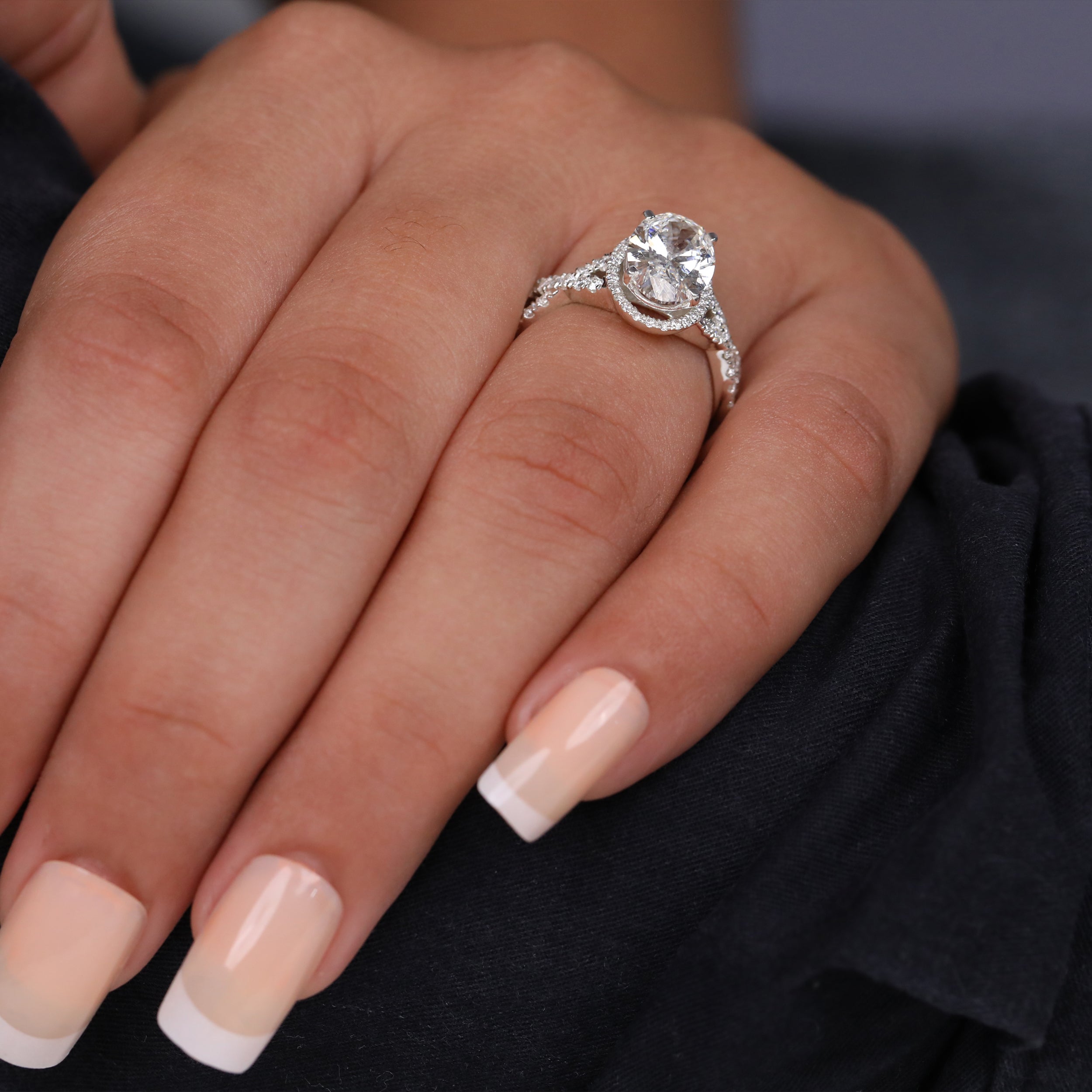 Oval Cut Lab Grown Diamond Halo Engagement Ring with Twisted Band