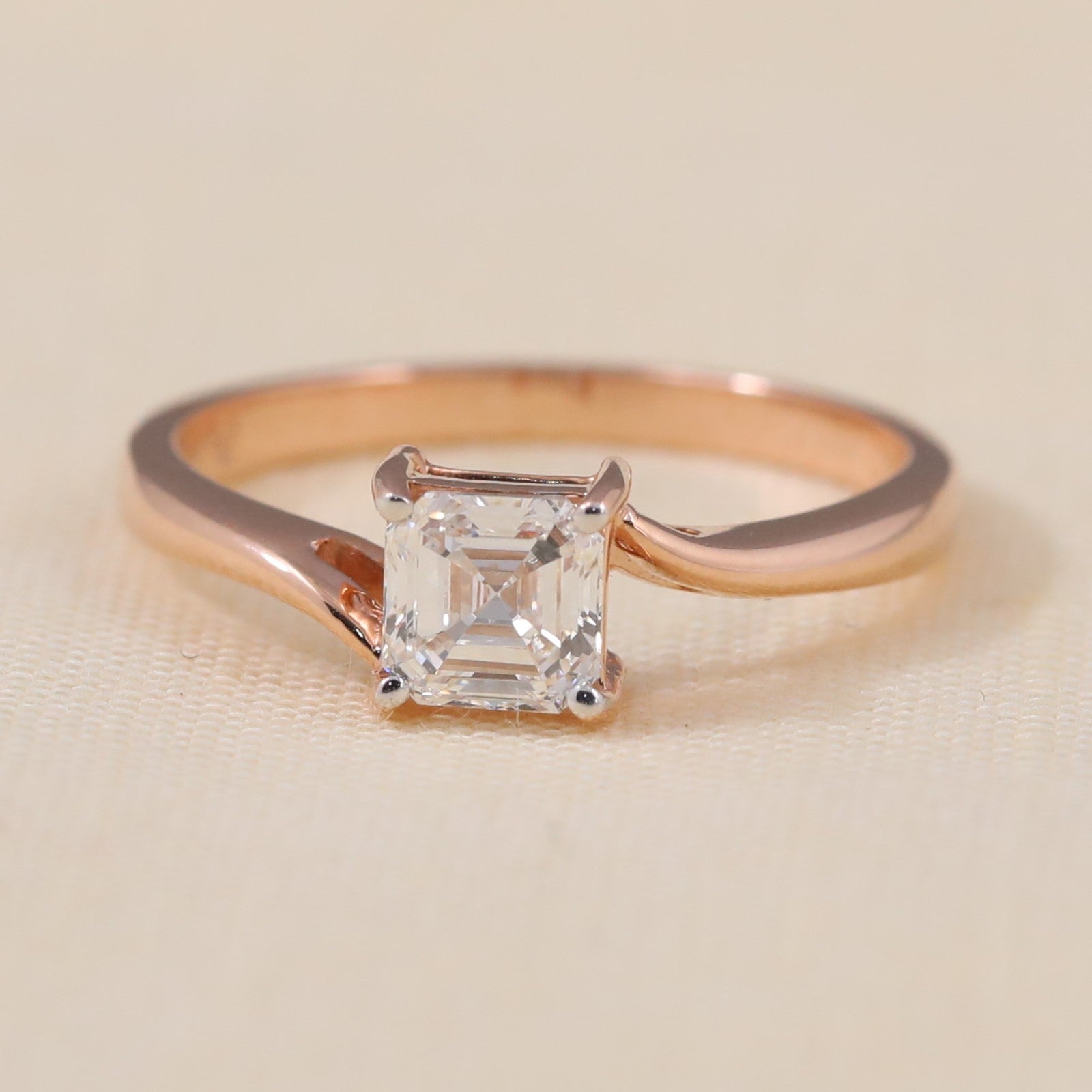 Asscher cut lab grown diamond solitaire ring featuring a sleek rose gold band