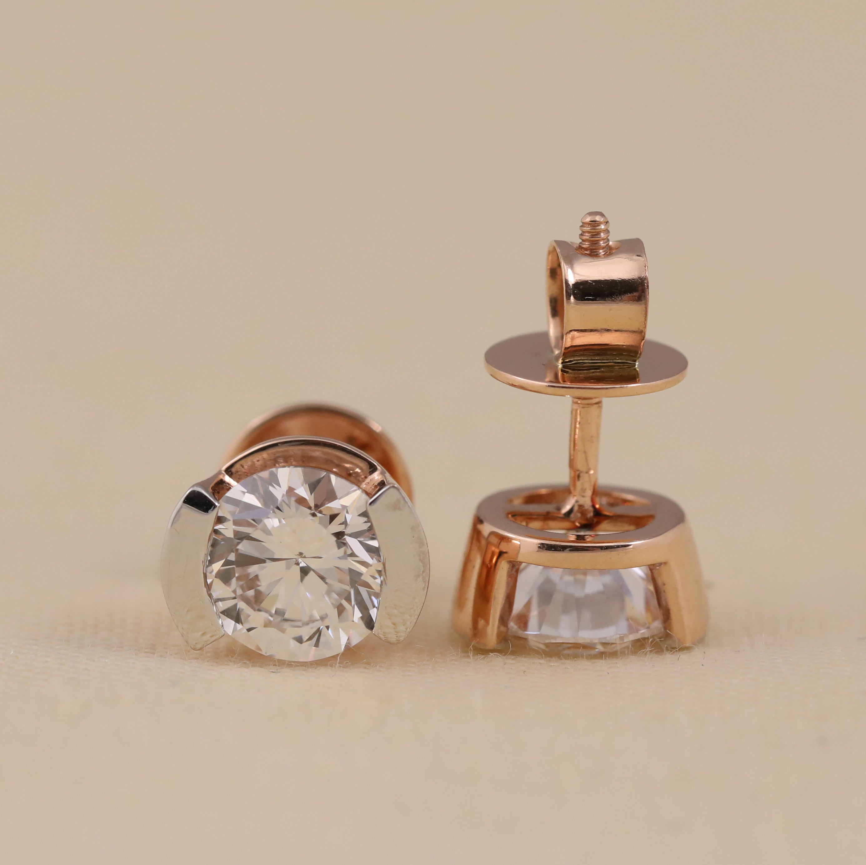 Stylish half-bezel round diamond earrings suited for daily wear and parties.