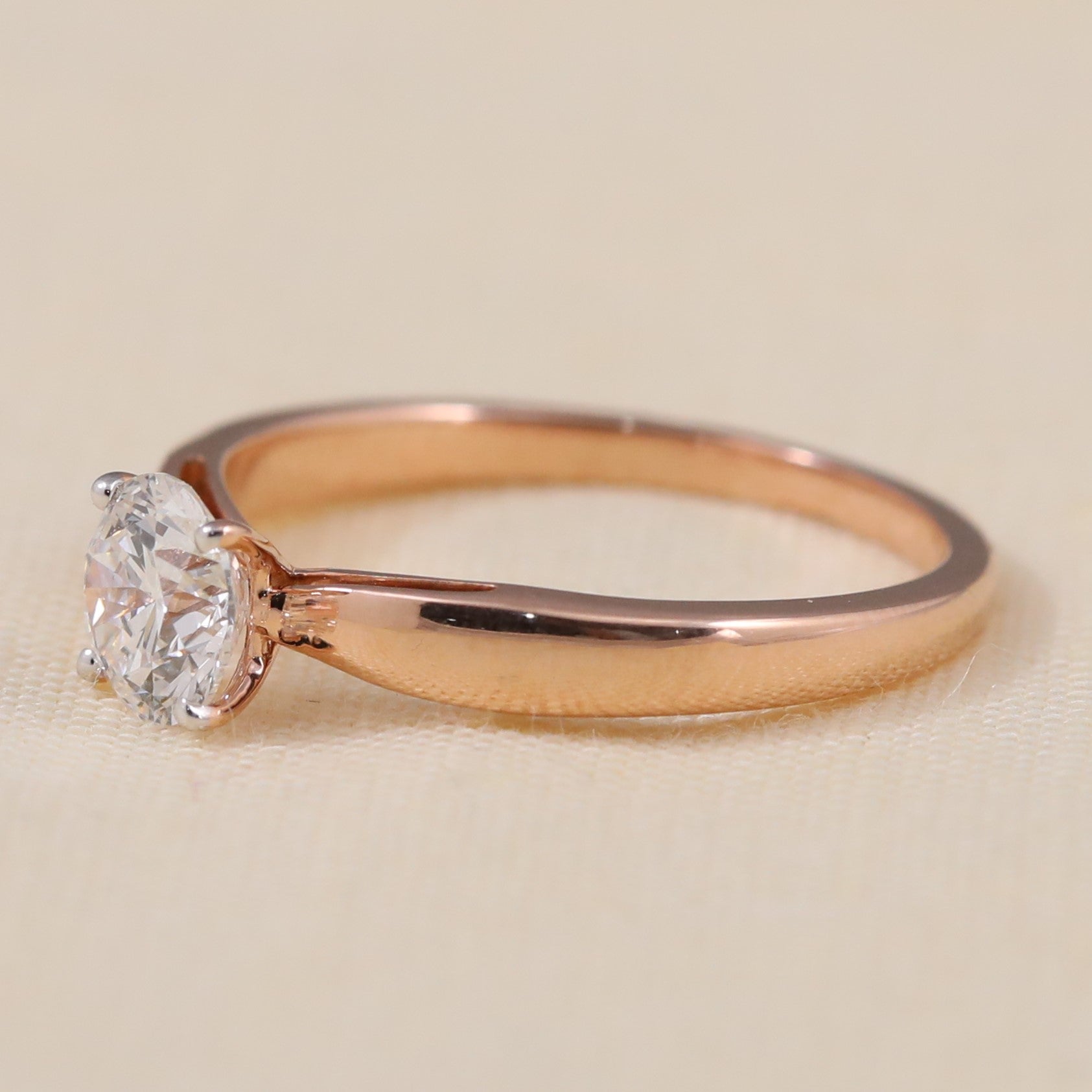 Minimalist solitaire ring showcasing a brilliant round lab grown diamond centerpiece