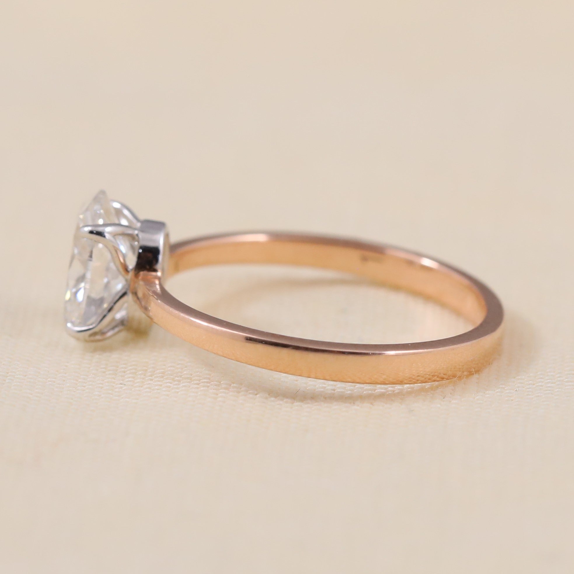 Timeless oval lab grown diamond ring crafted with a simple slim band