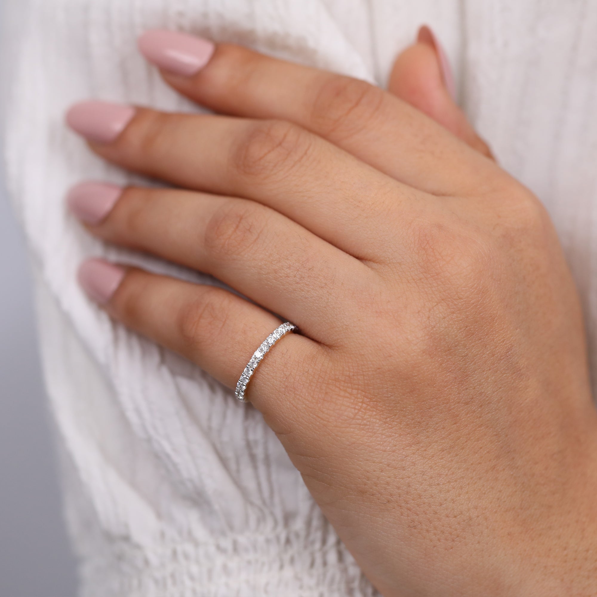 Premium pavé diamond band crafted in yellow gold with closely set brilliant round stones.