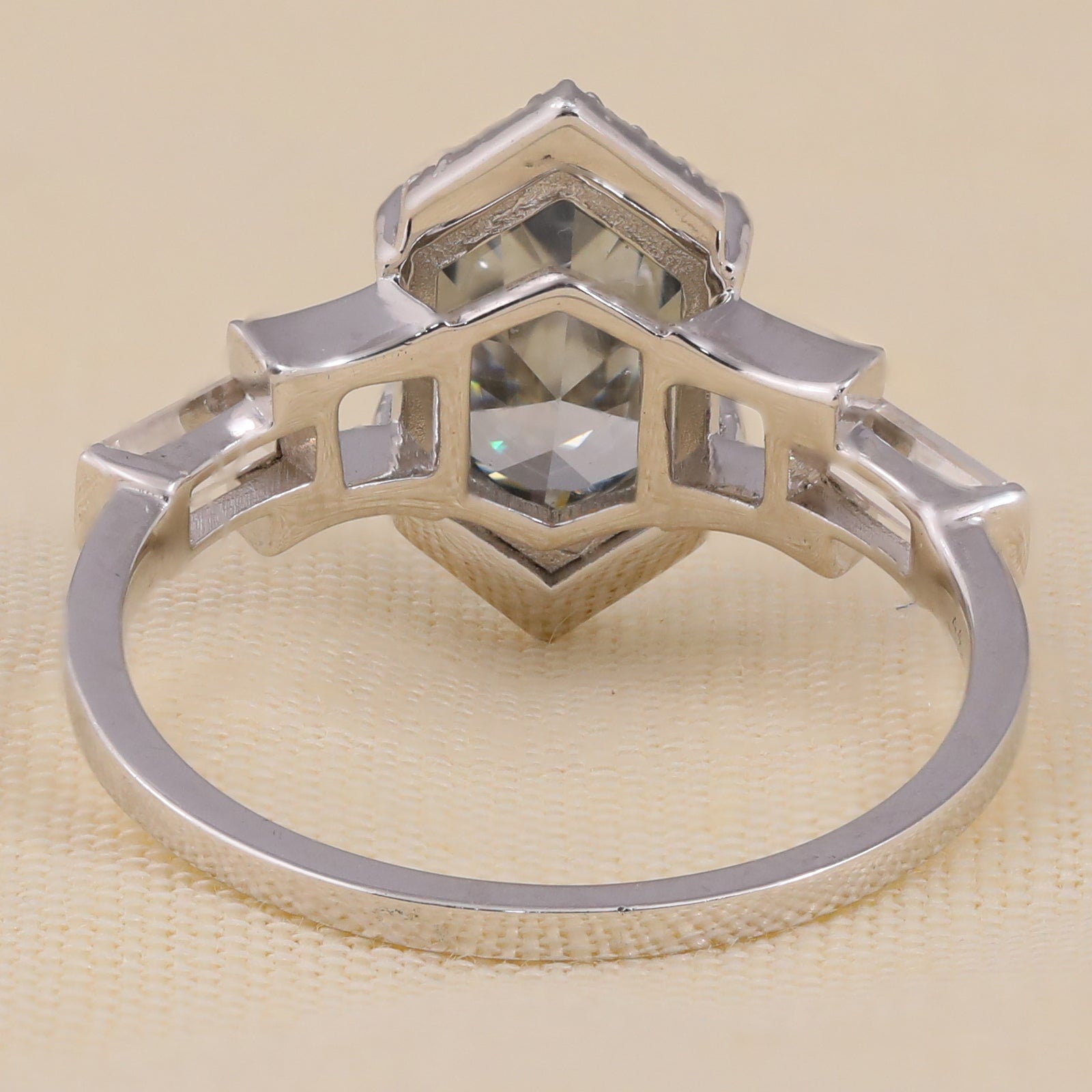 Contemporary hexagon solitaire engagement ring with side diamonds