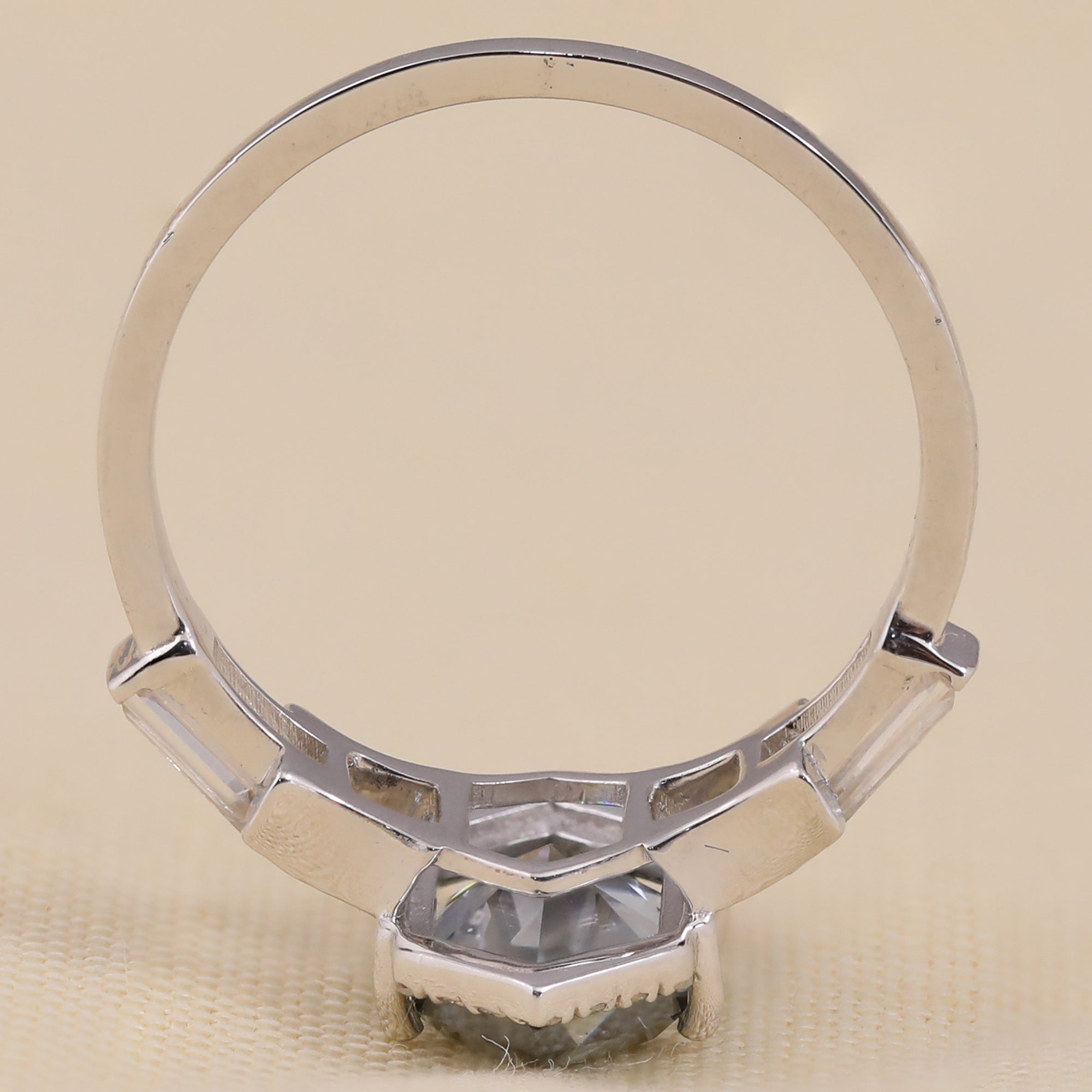 Hexagon halo diamond ring with baguette shoulders