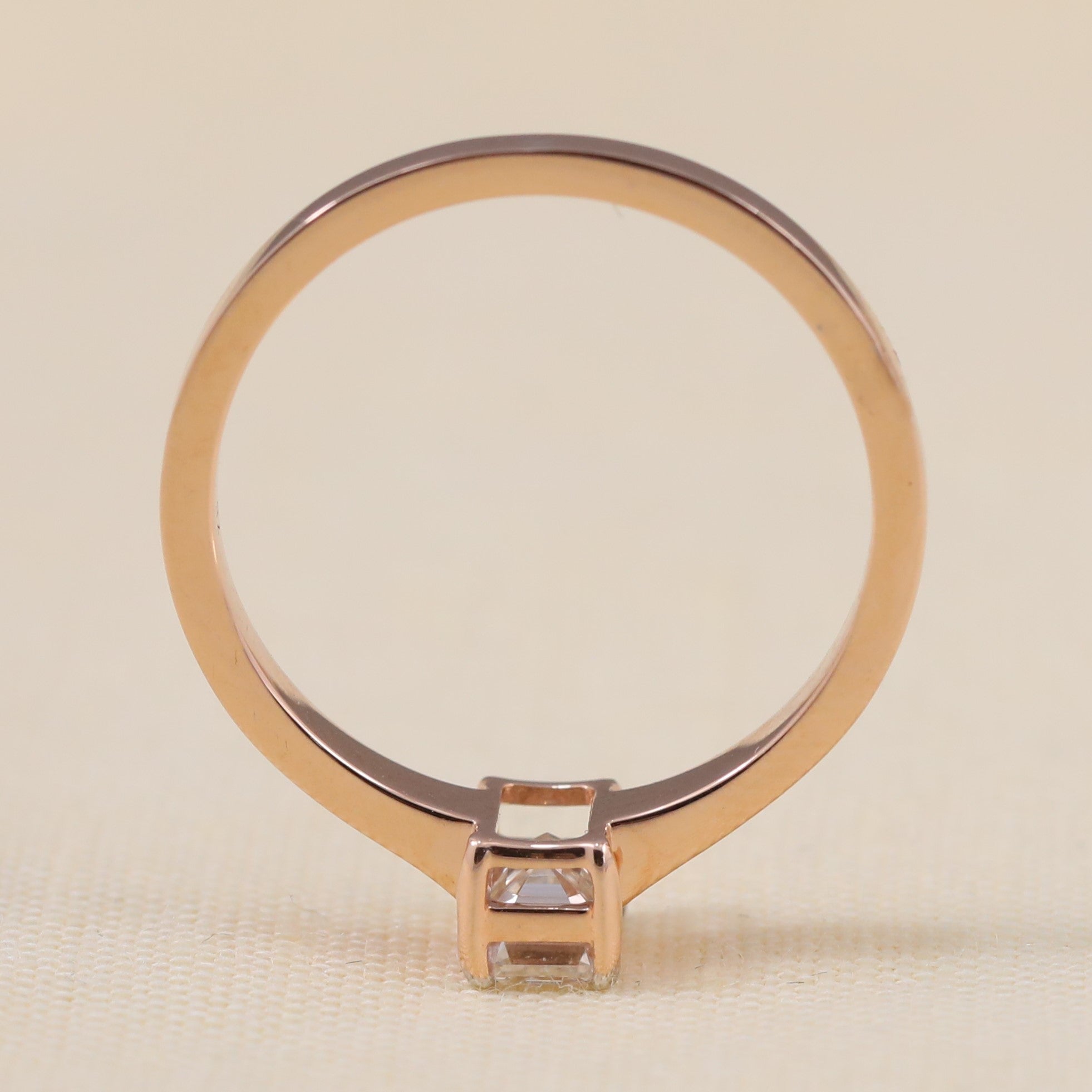 Delicate solitaire ring featuring a radiant emerald-cut lab-grown diamond centerpiece