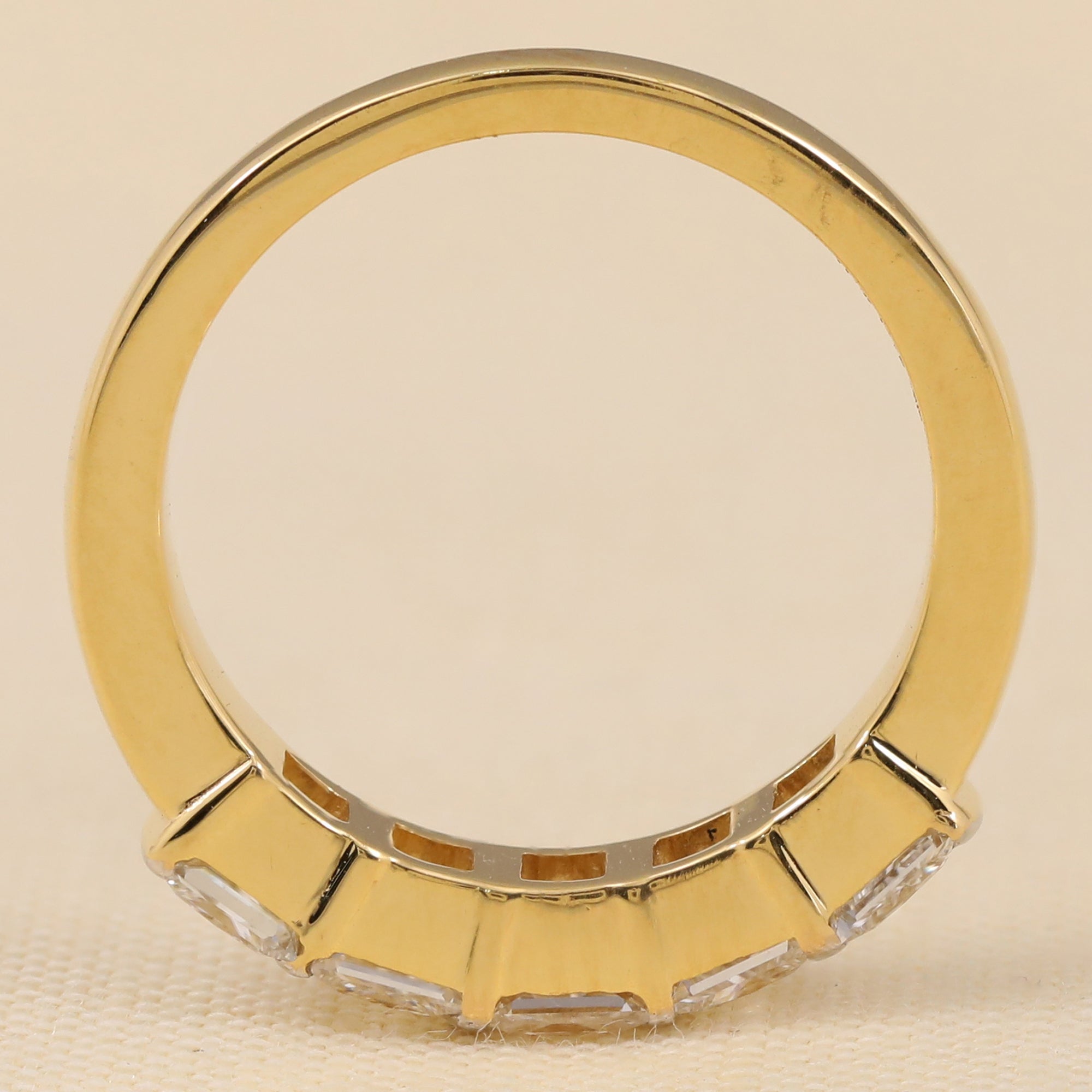 Stylish lab-created diamond ring showcasing a straight row of princess-cut diamonds