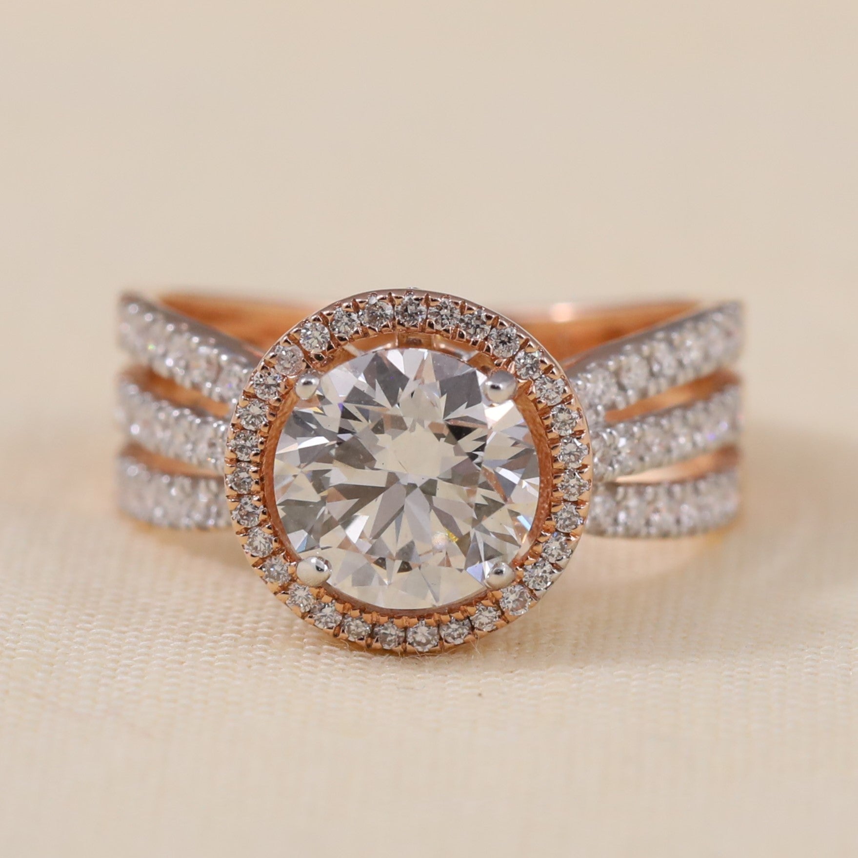 Round lab grown diamond halo ring featuring a bold triple row band