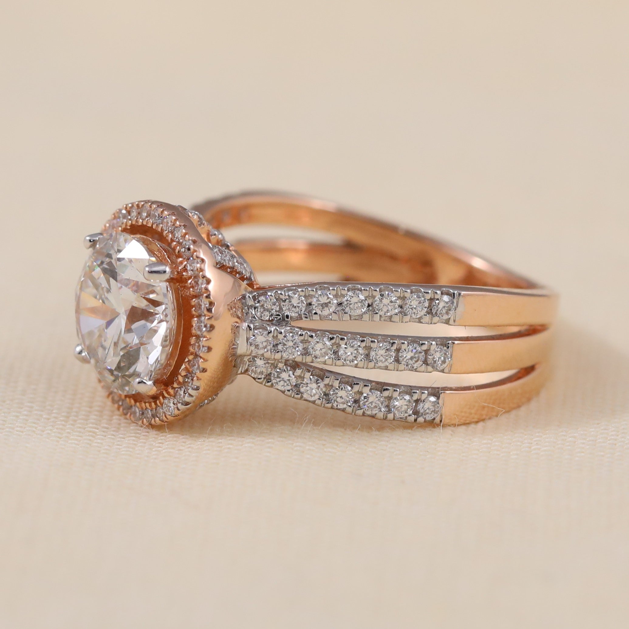 Elegant halo engagement ring with round lab grown diamond and three row shank
