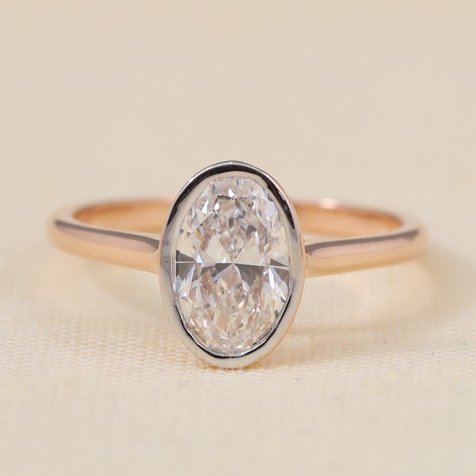 Oval bezel  lab grown diamond engagement ring perfect for elegant proposals