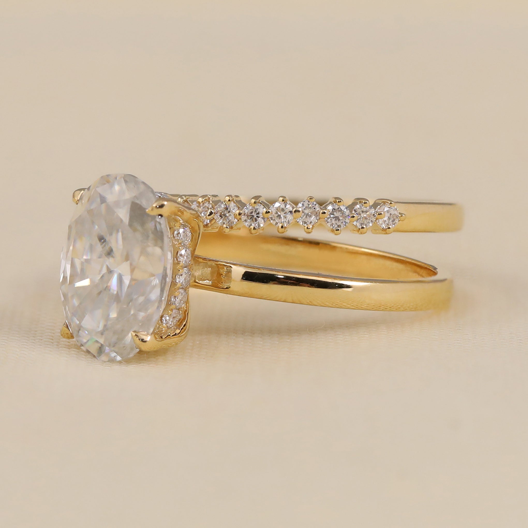 Elegant oval lab-grown diamond engagement ring paired with a sparkling wedding band.
