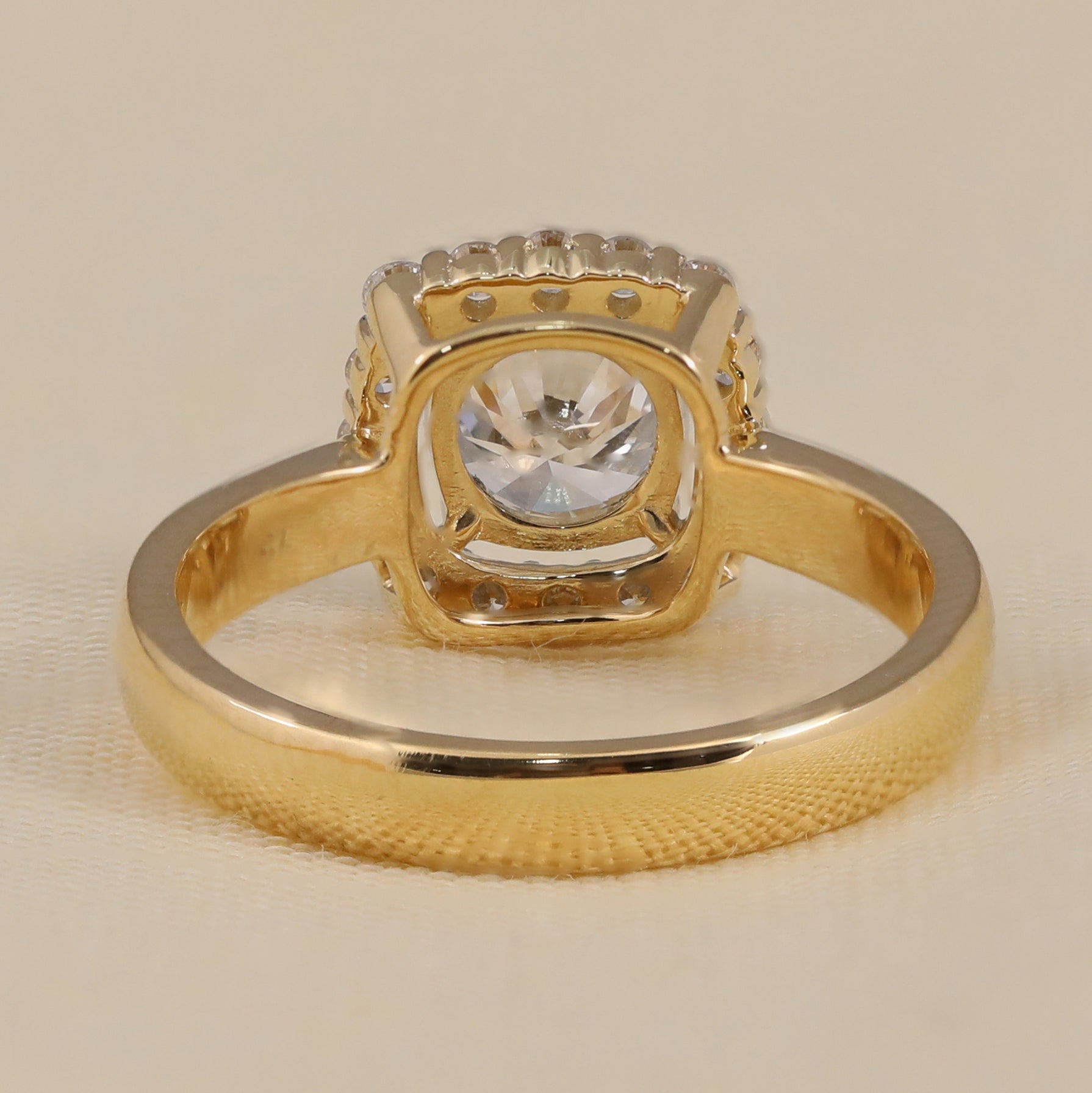 Round cut lab grown diamond ring featuring a sparkling halo design