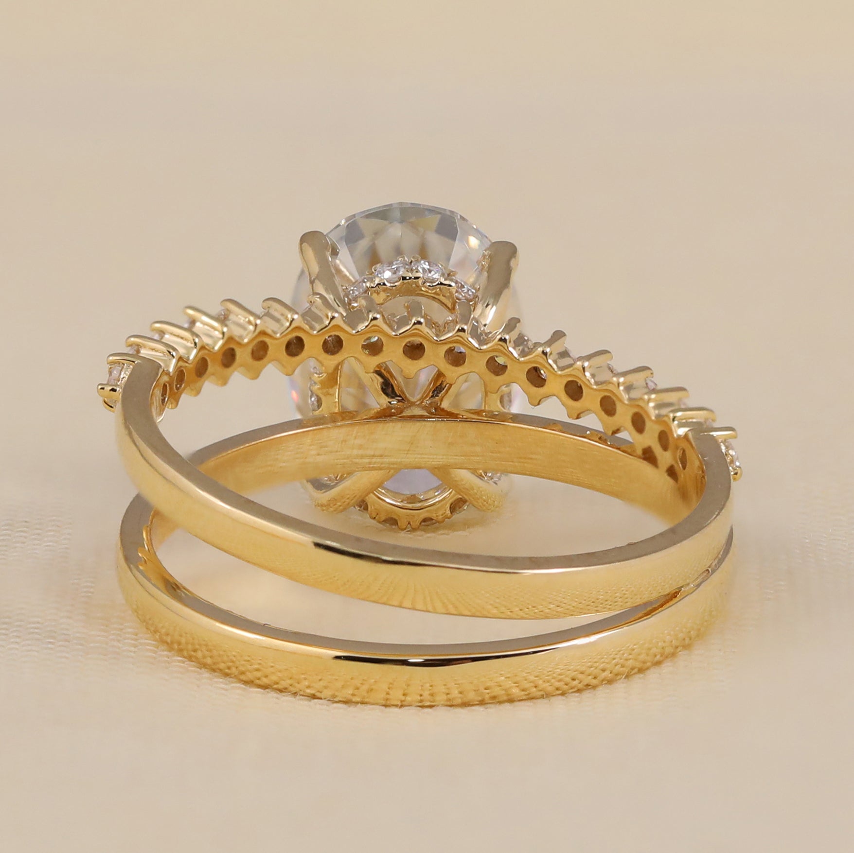 Two-piece bridal set with an oval lab-grown diamond and a delicate pavé band.