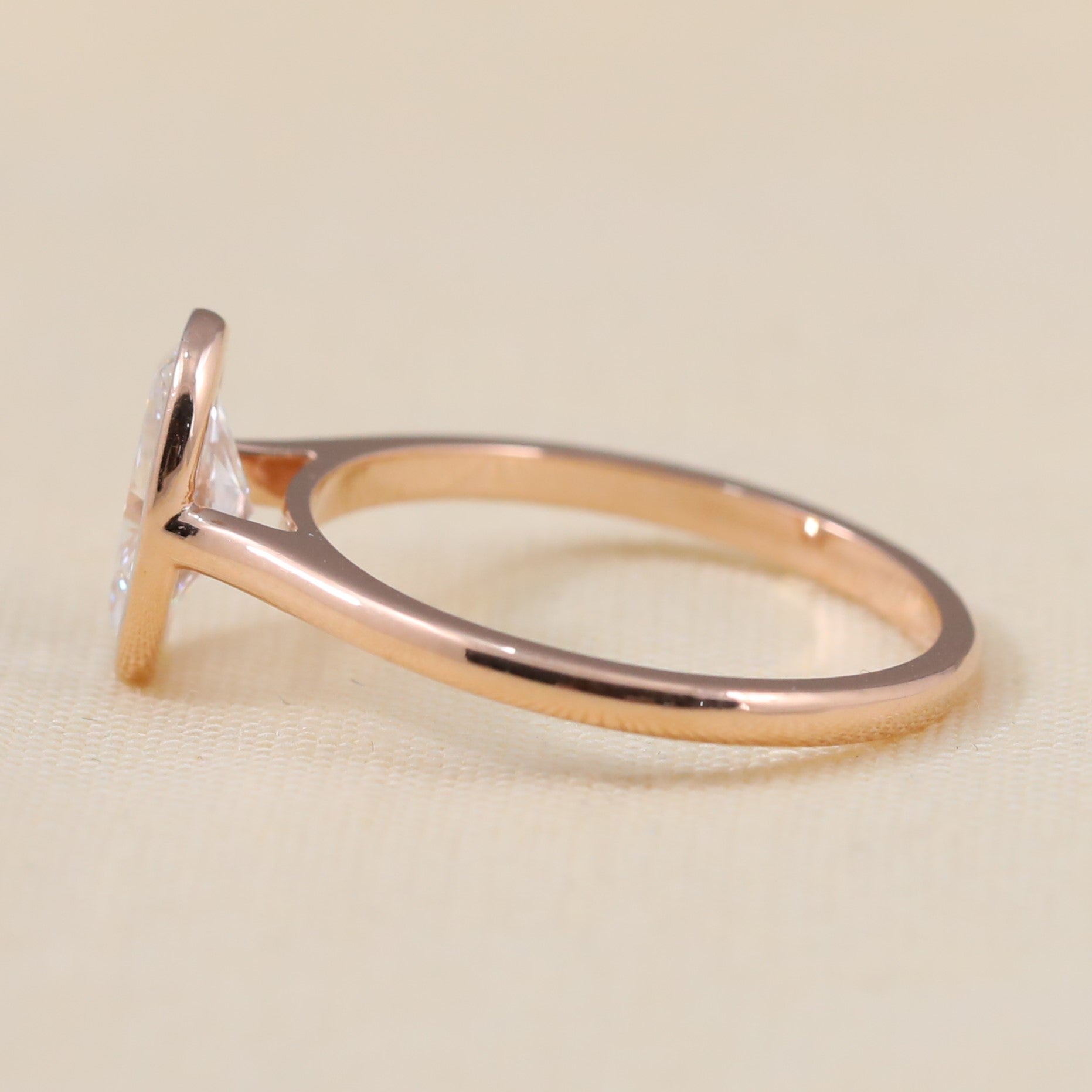 Bezel set oval lab grown diamond promise ring with clean modern design