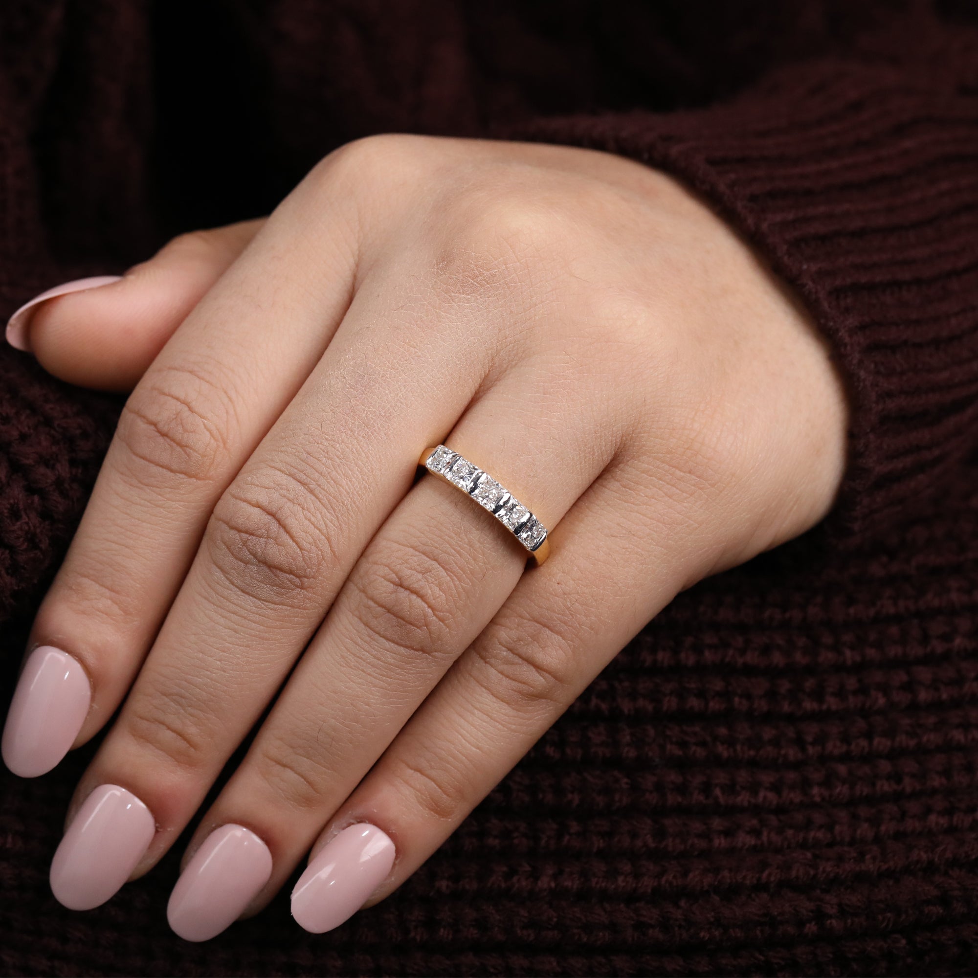 Minimalist lab diamond ring showcasing a uniform lineup of princess-cut stones