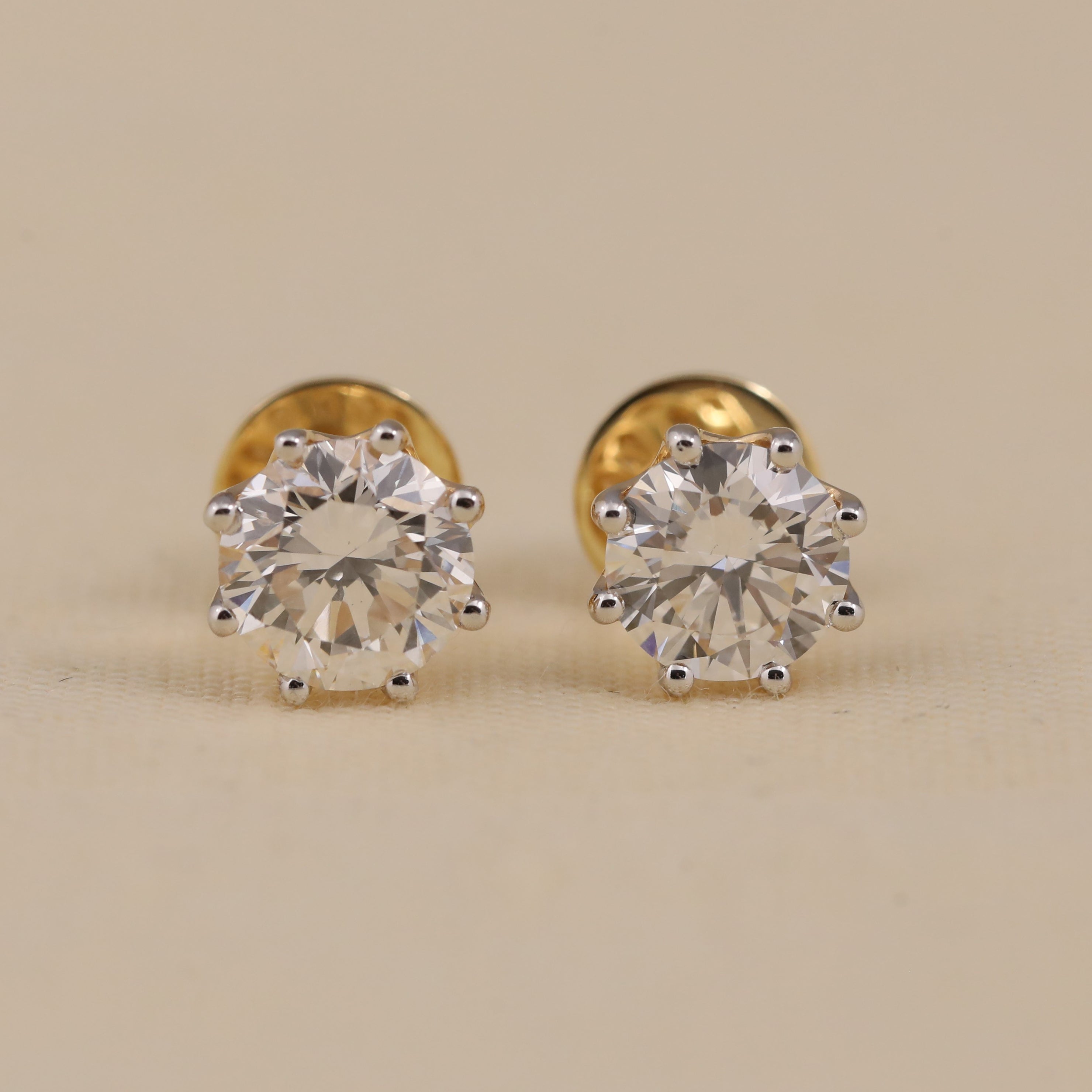 Round solitaire diamond stud earrings perfect for wedding or anniversary gifting.