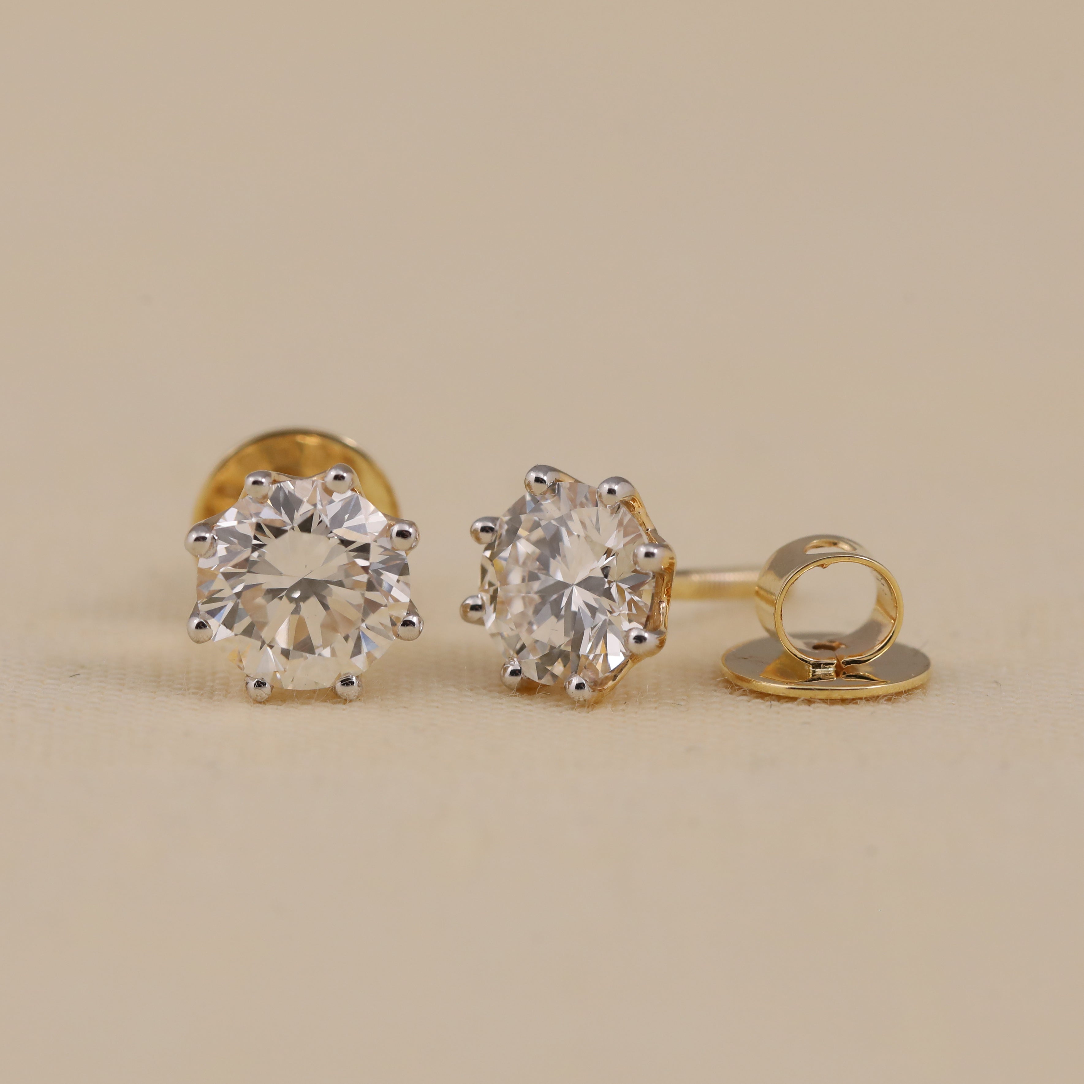 Timeless round diamond earrings ideal for anniversary and festive moments.