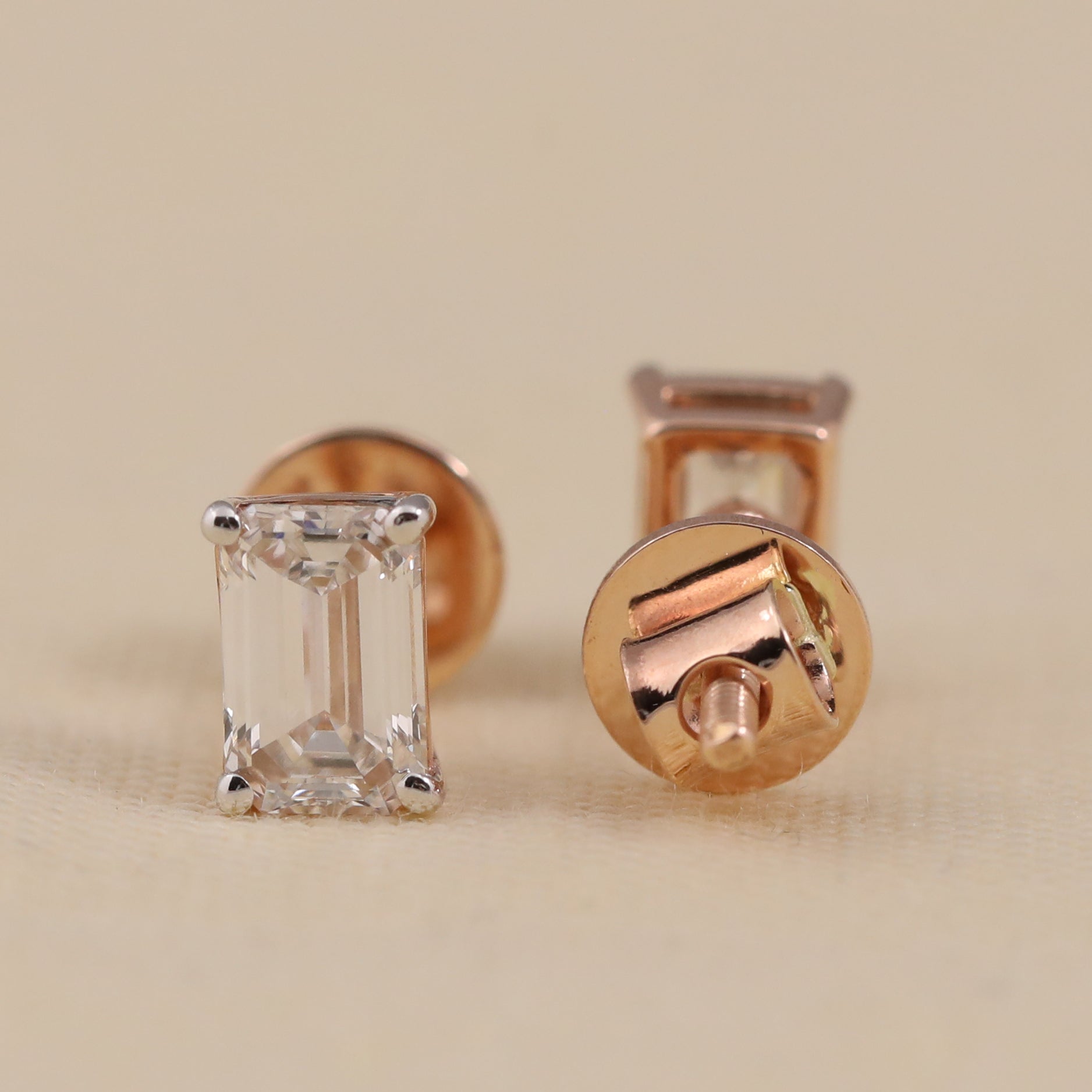 Elegant emerald-cut diamond studs ideal for engagement and special occasions.