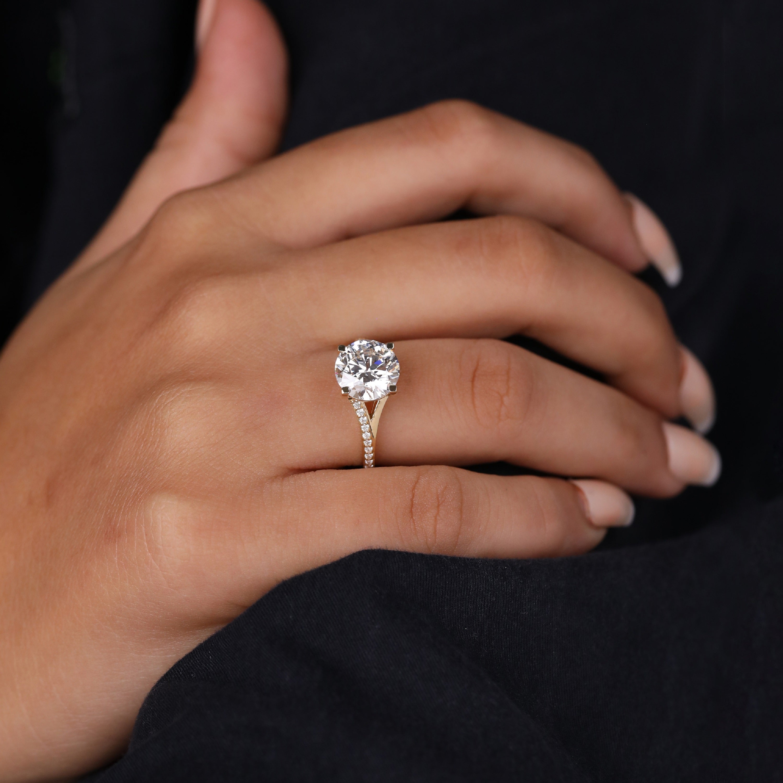 Round diamond ring with yellow gold split shank and pavé accents