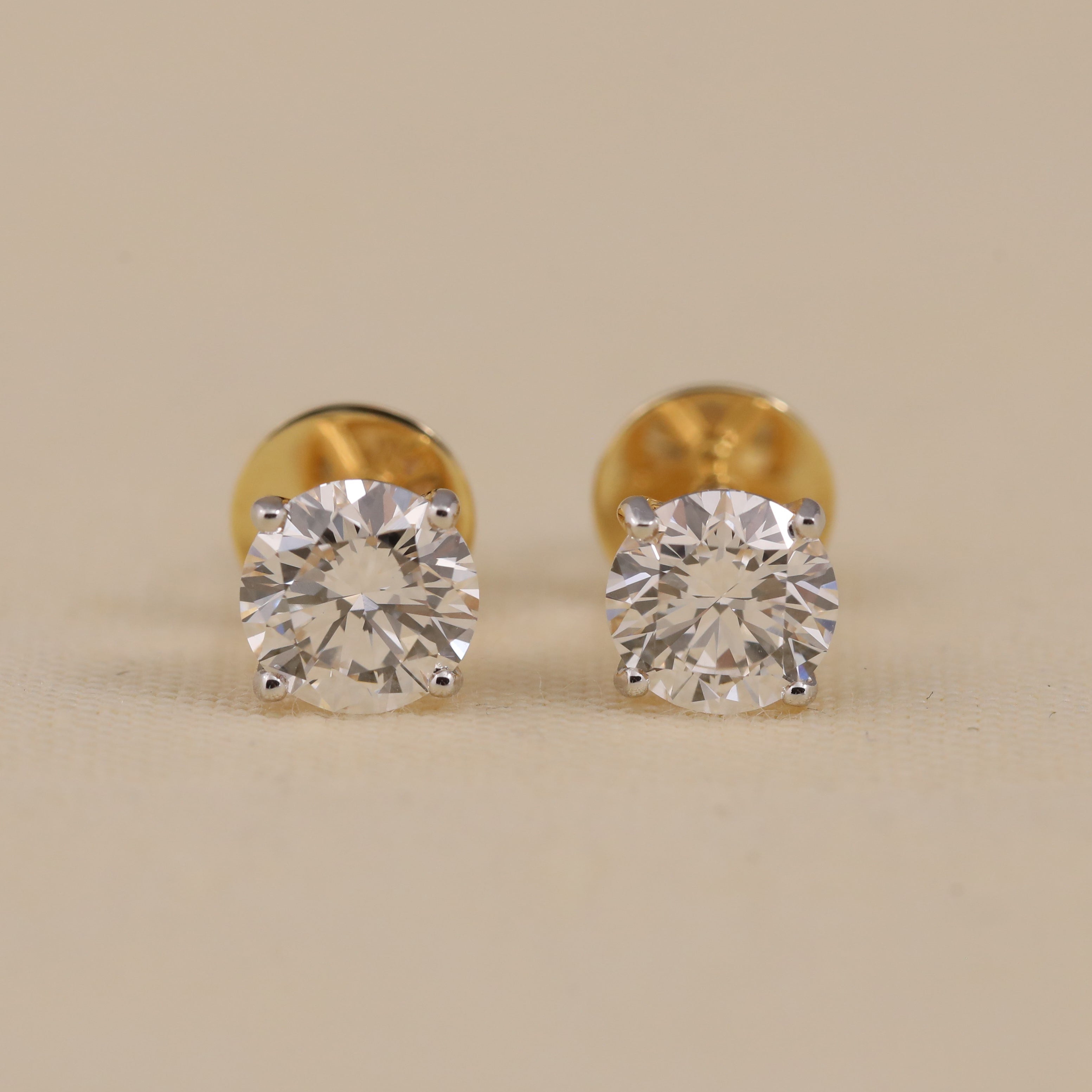 Round solitaire diamond stud earrings perfect for wedding gifting.