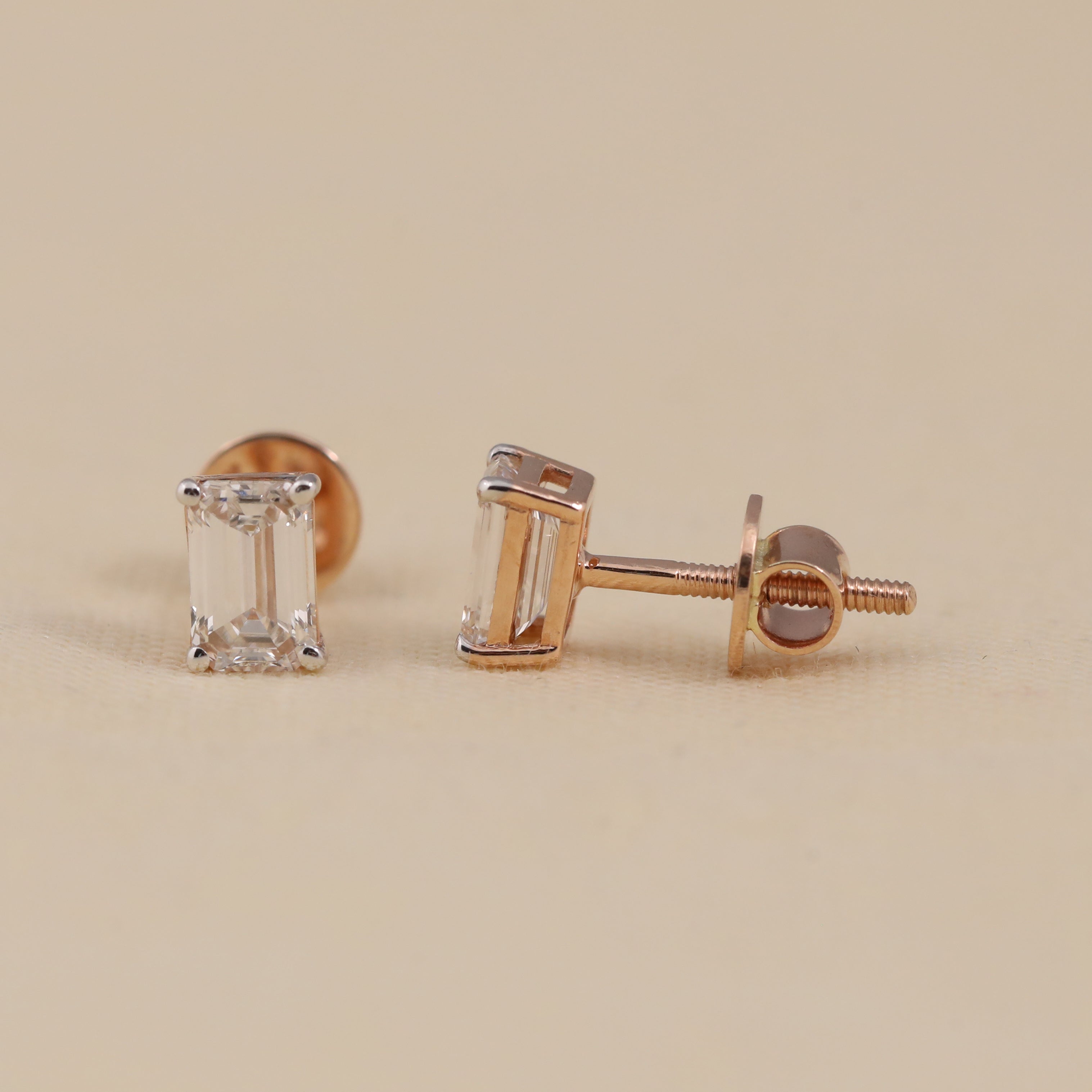 Classic emerald-cut diamond studs perfect for birthday and festive gifting.