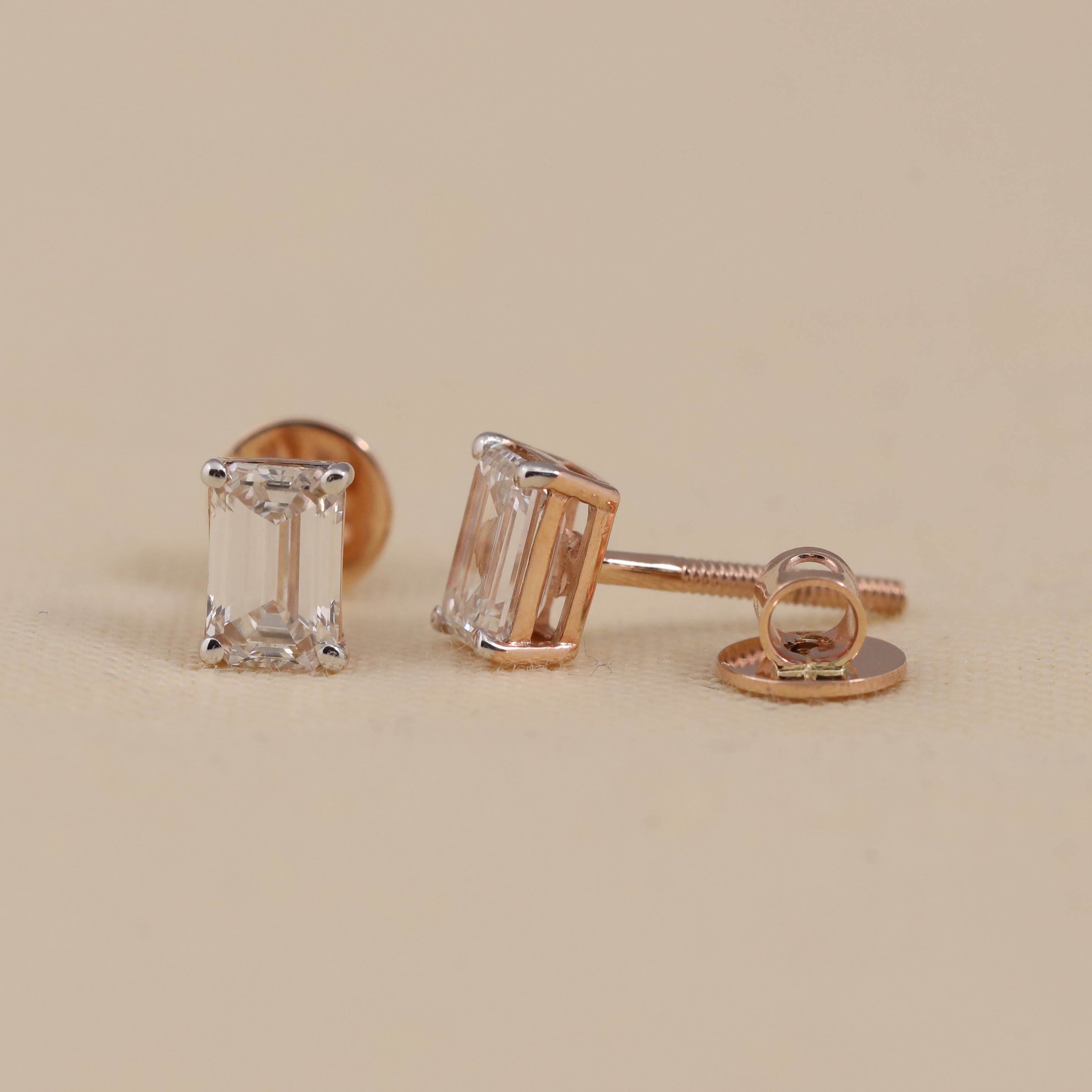 Timeless emerald-cut diamond earrings ideal for wedding and party looks.