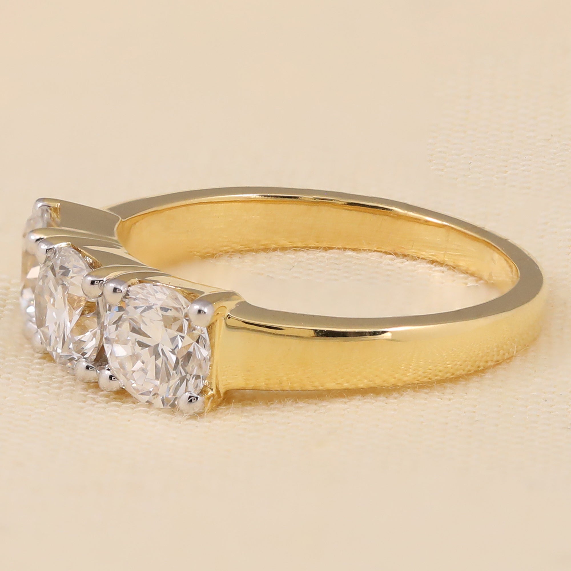 Round-cut lab-grown diamond trio ring with a classic three-stone sparkle