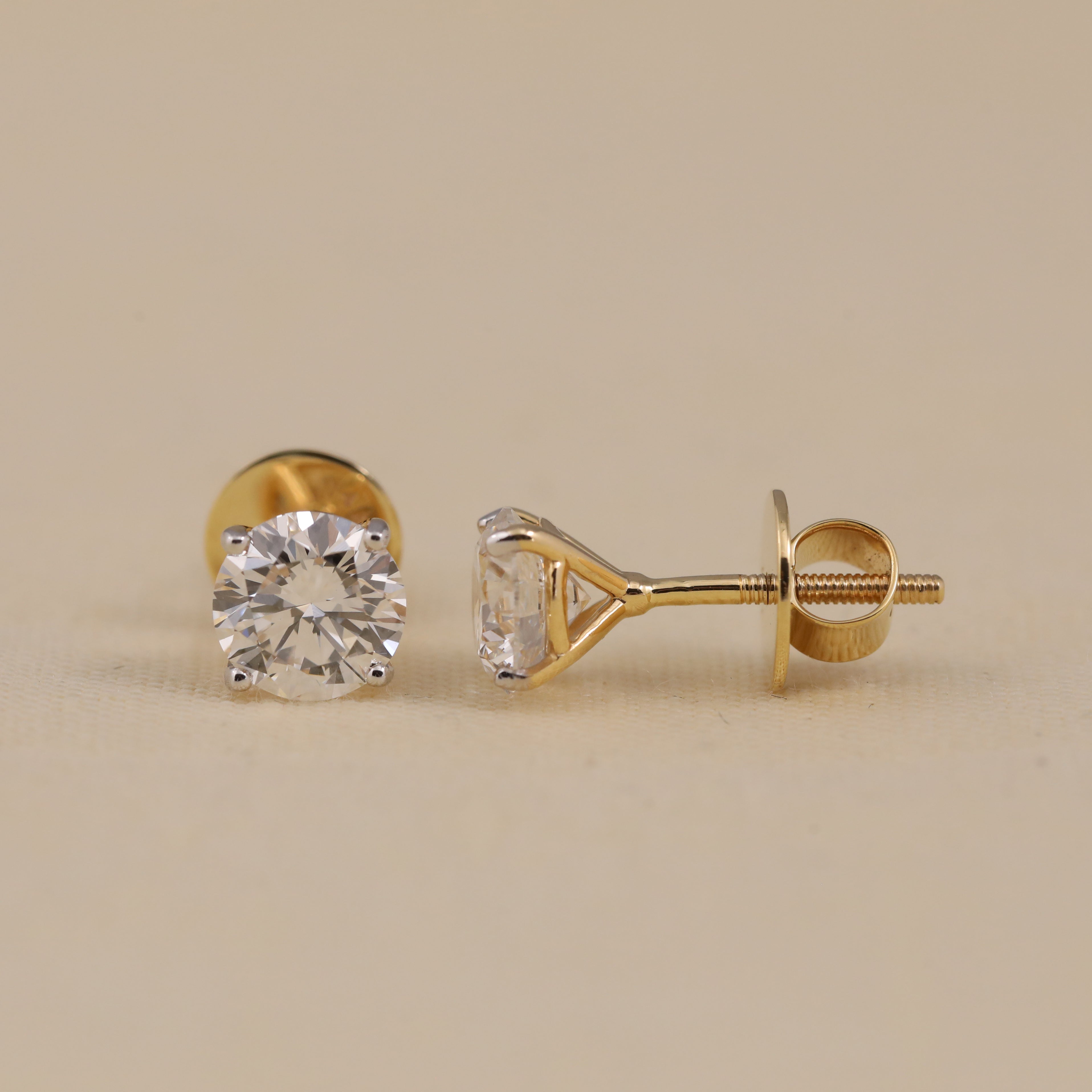 Brilliant solitaire diamond studs perfect for festive occasions.