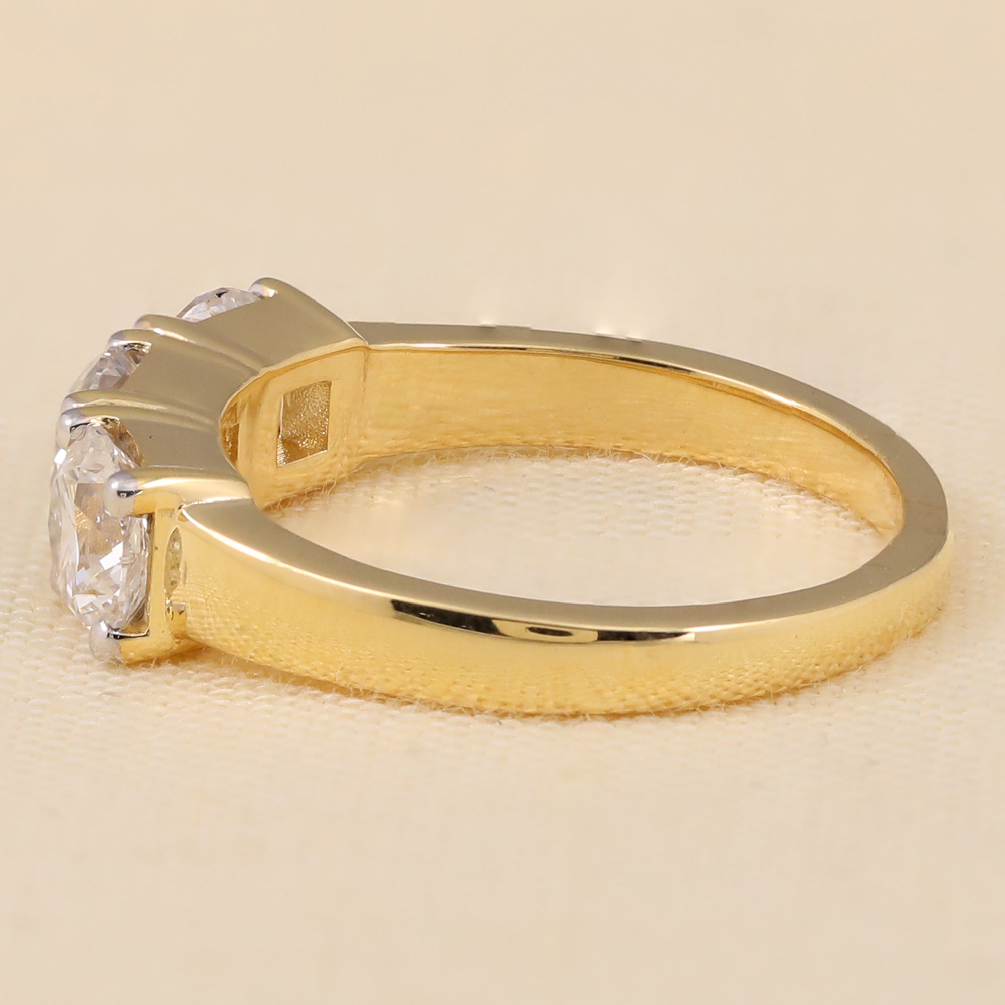 Elegant three-stone band set with radiant round lab diamonds for timeless shine