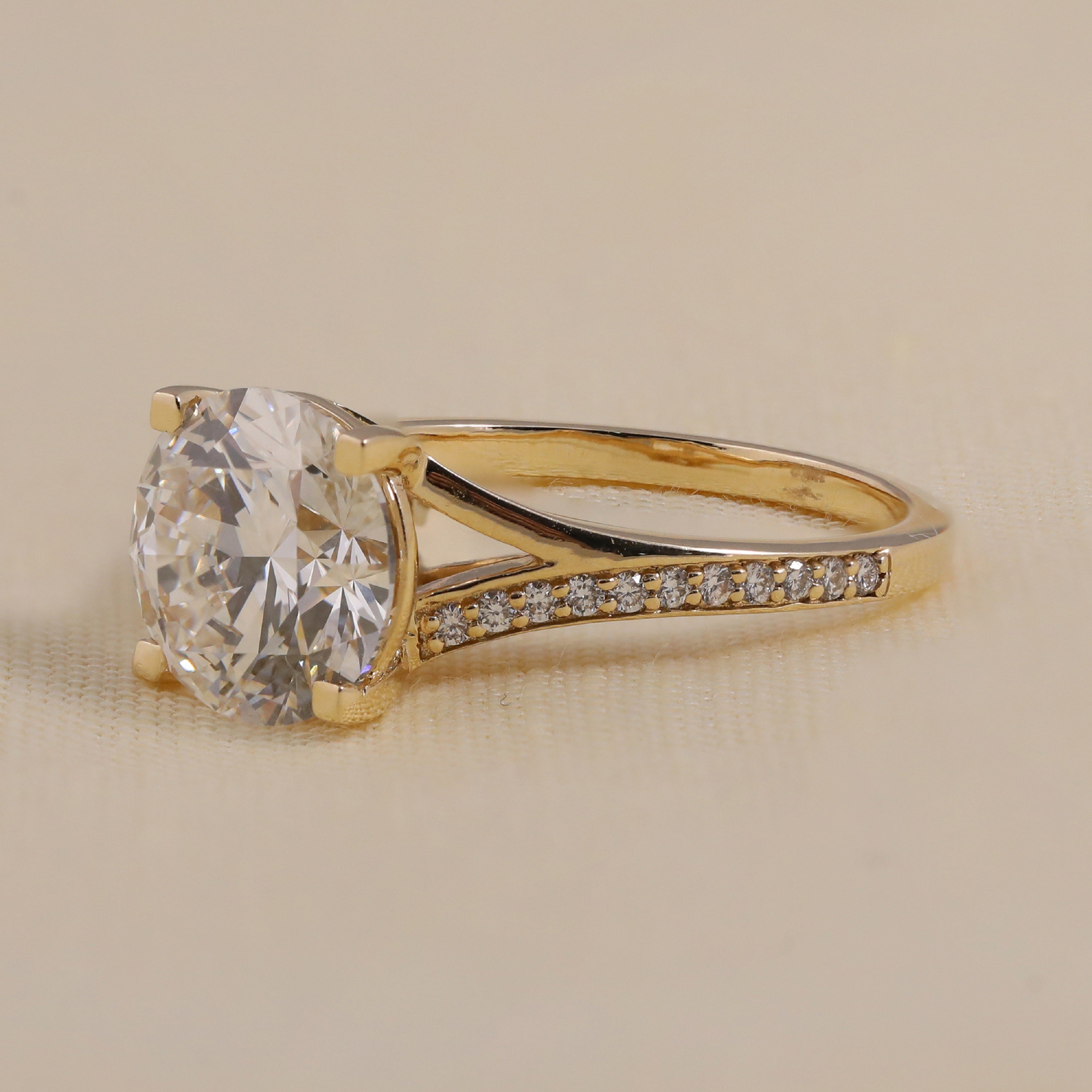 Lab grown diamond engagement ring featuring a round cut center stone in a classic solitaire style