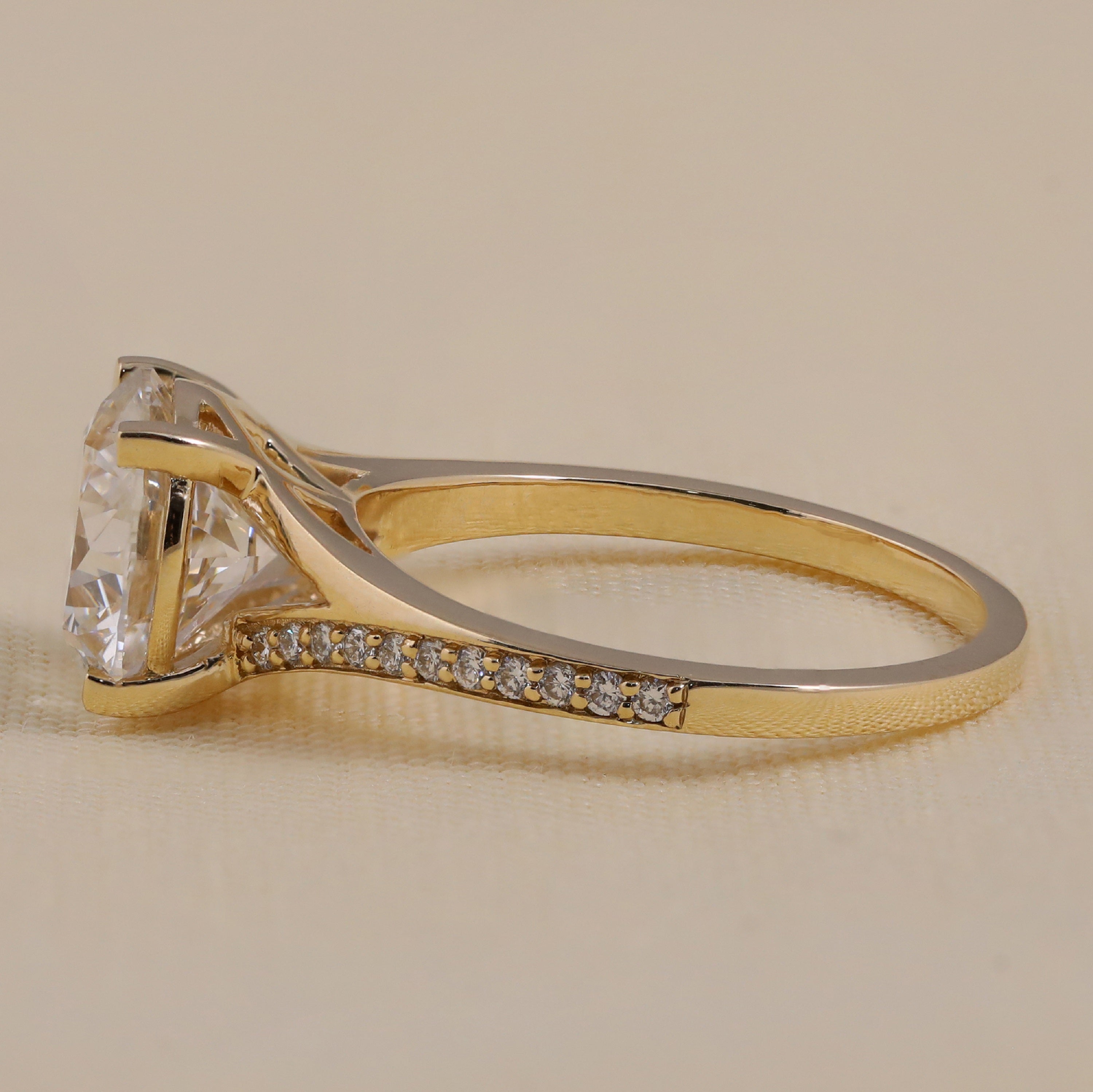 Elegant round lab-grown diamond solitaire engagement ring with a delicate pavé band