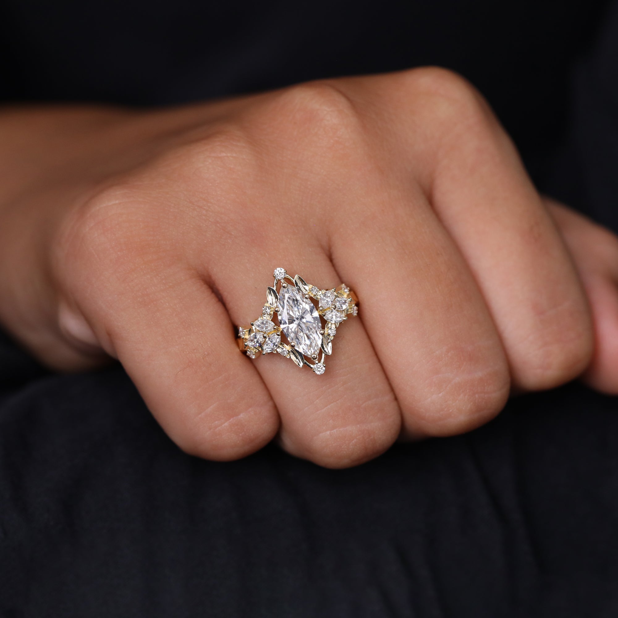 Luxury marquise-cut diamond ring with elaborate cluster and leaf detailing