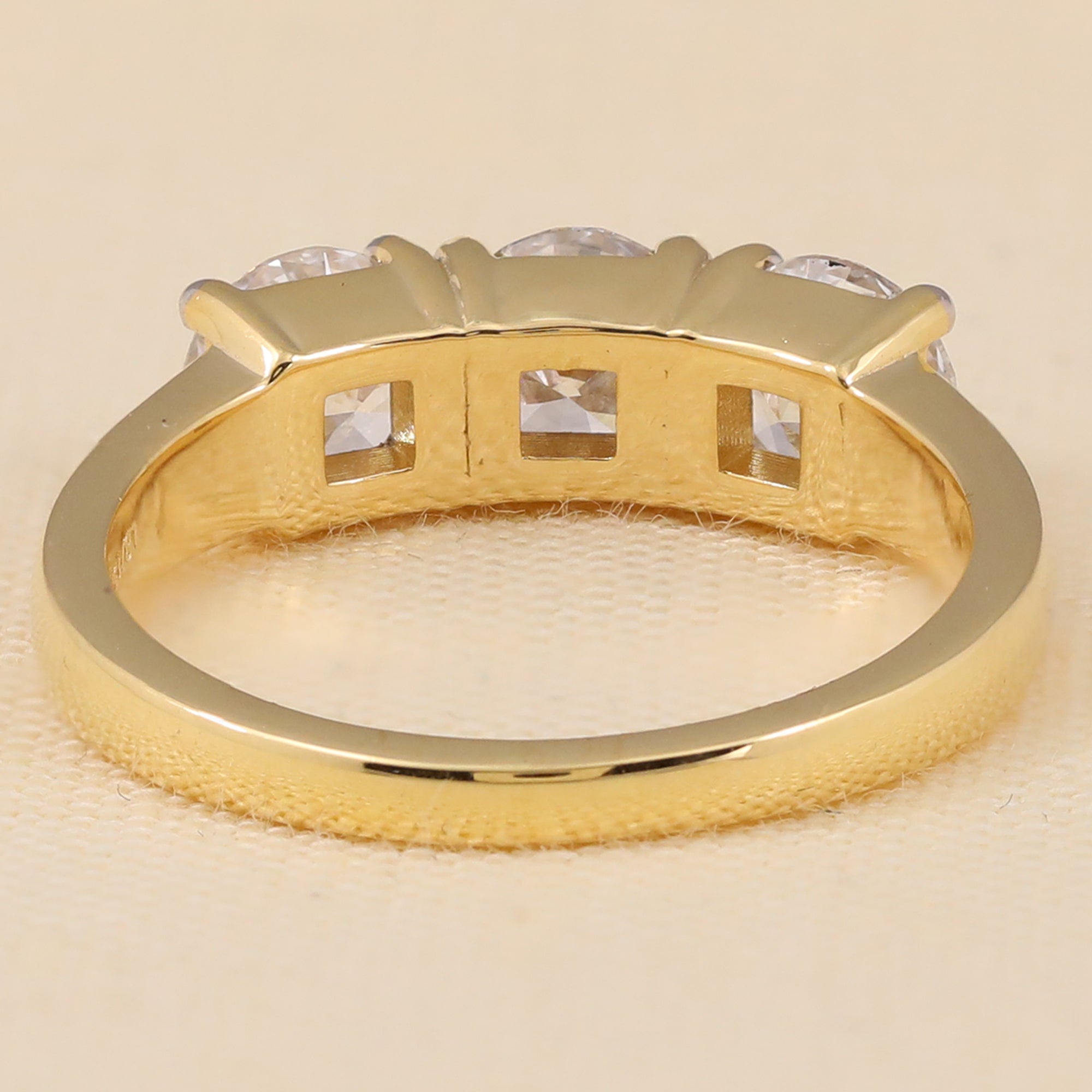 Three-round lab diamond ring with a bright, eye-catching center stone and matched sides