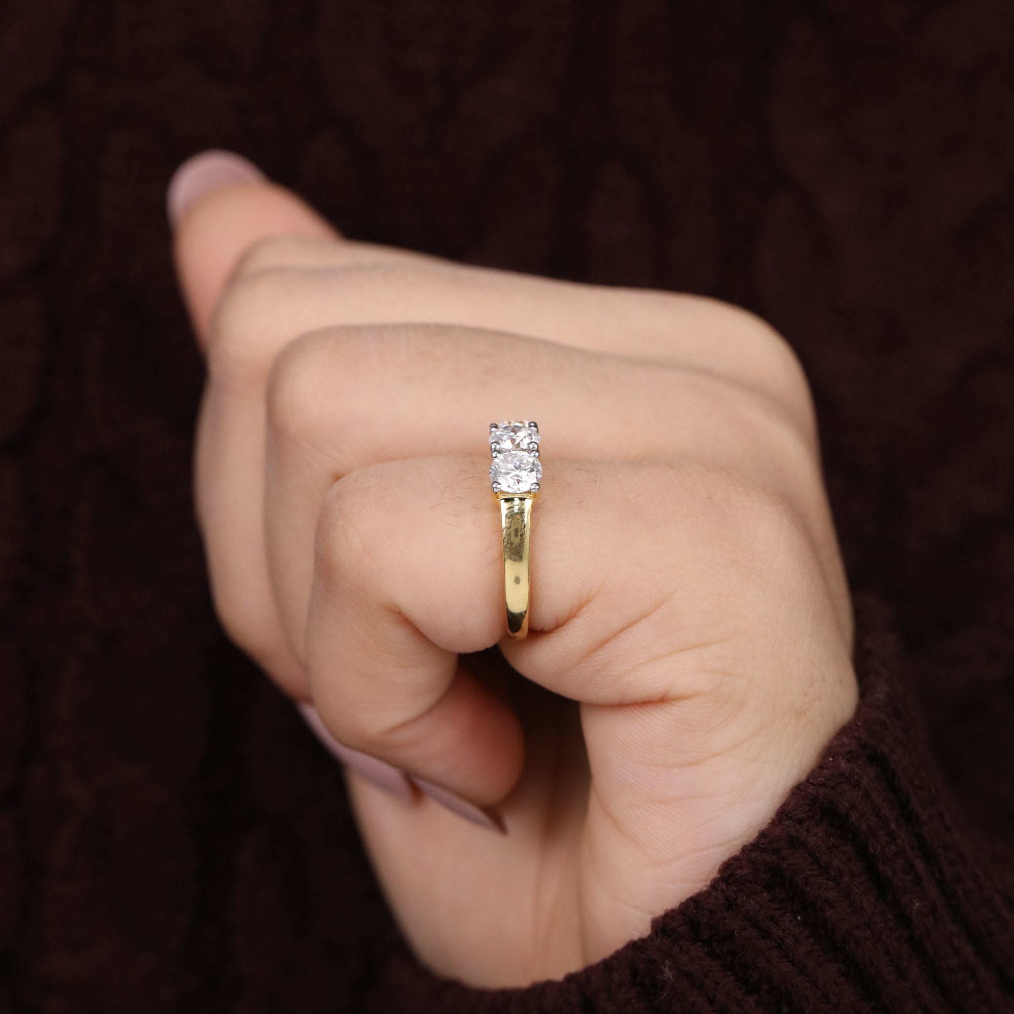 Timeless three-diamond ring with lab-grown round stones for a classic look