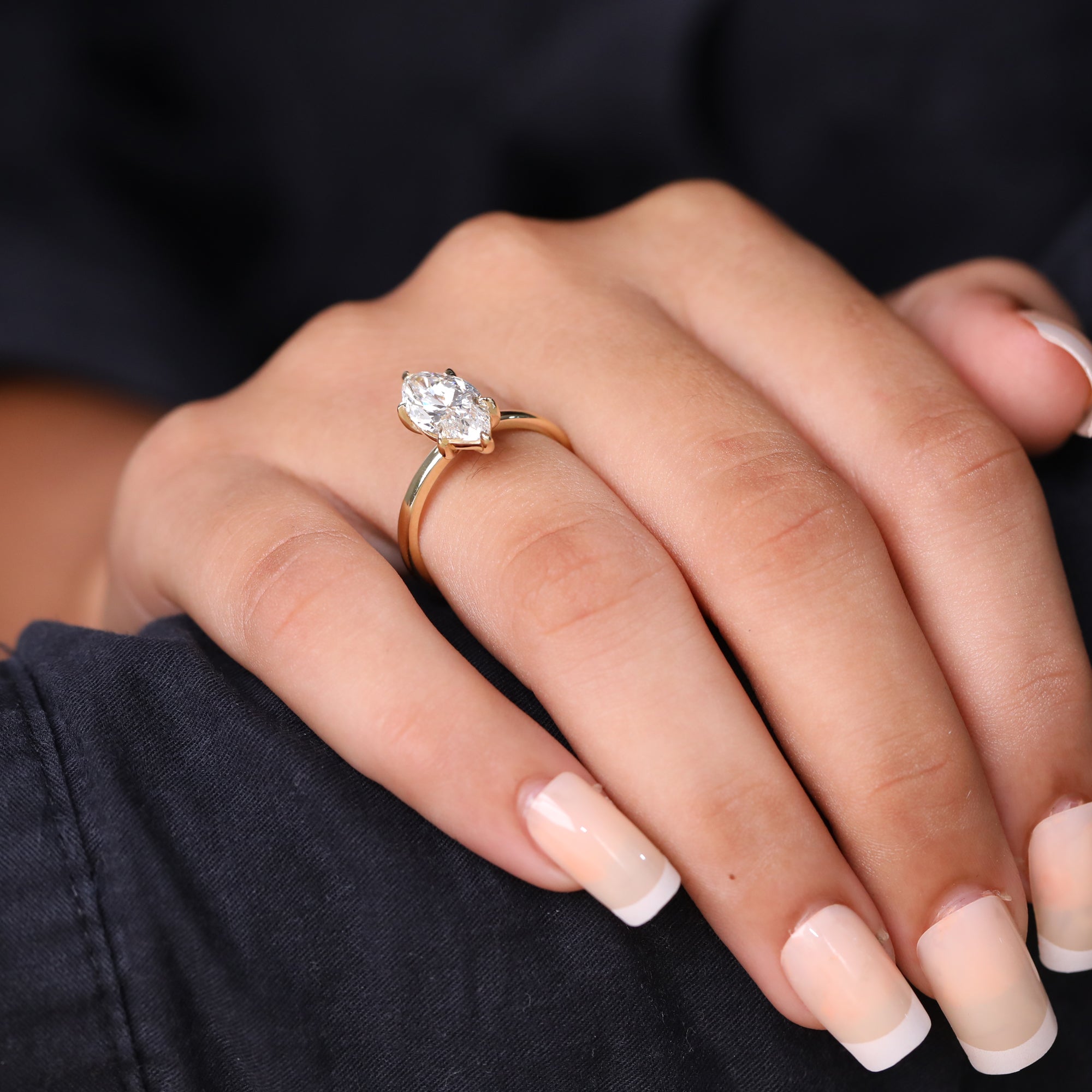 Minimalist yellow gold marquise-cut diamond engagement ring