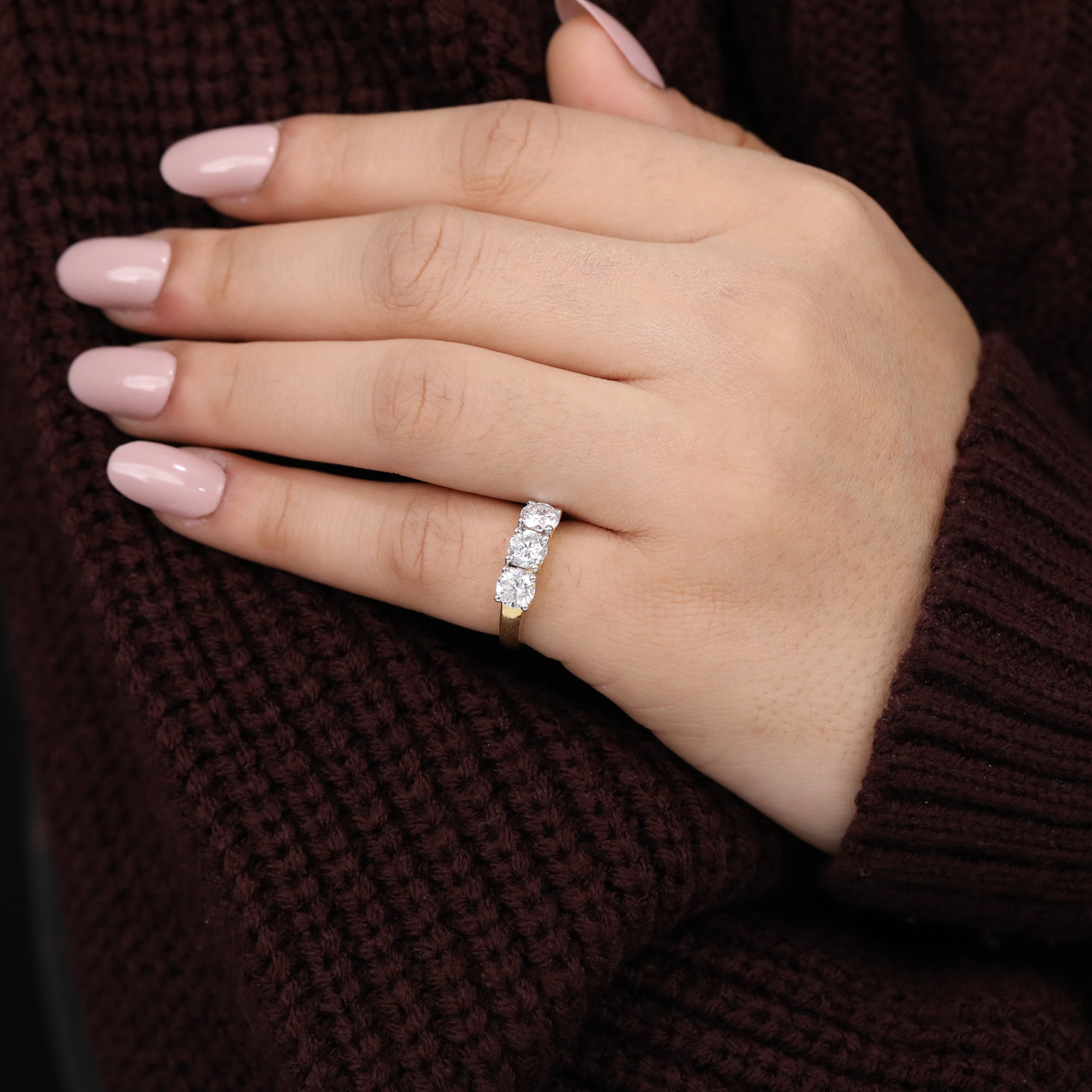 Three-round lab diamond engagement ring with a bright center stone and matching side diamonds