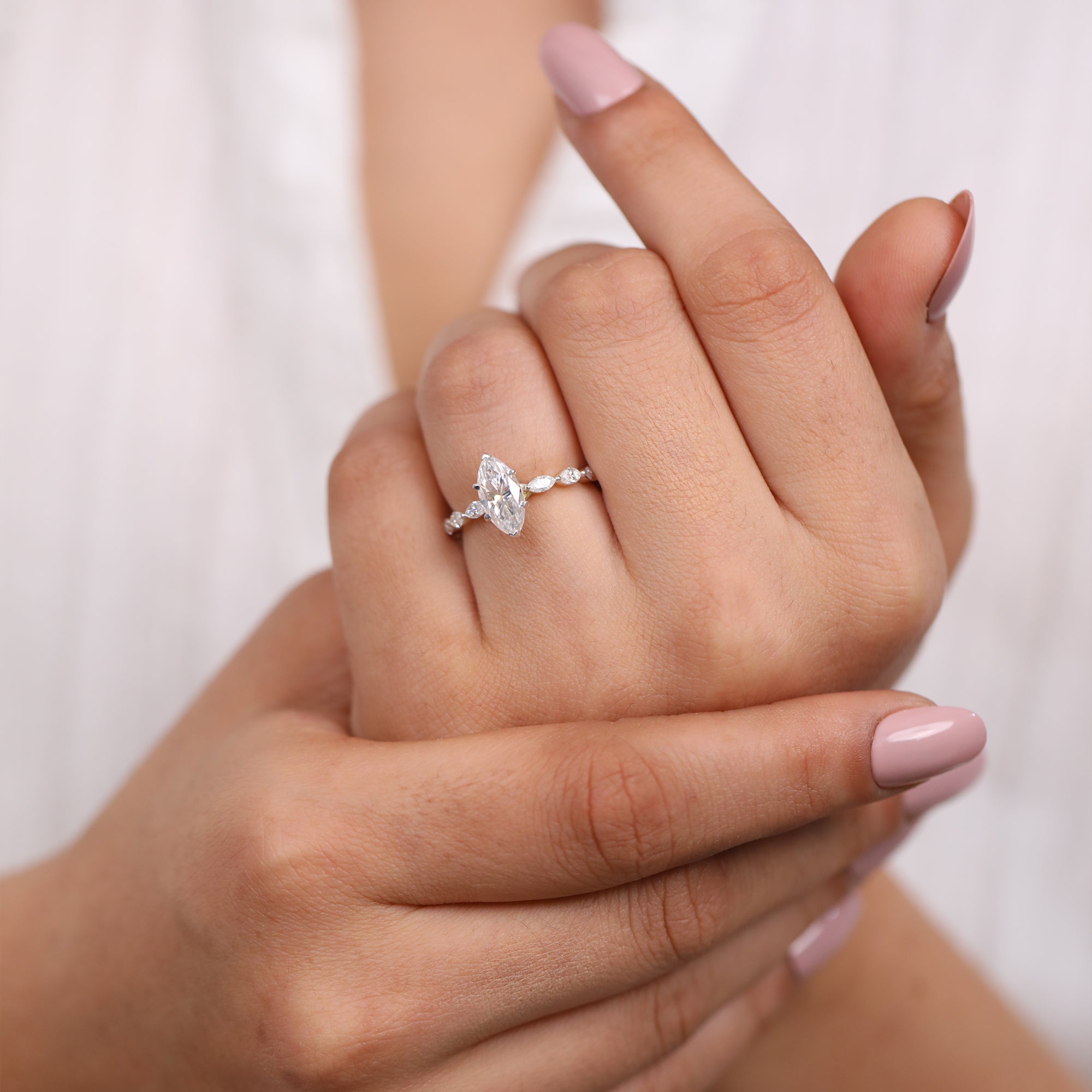 Fine jewelry marquise-cut engagement ring with marquise side diamonds