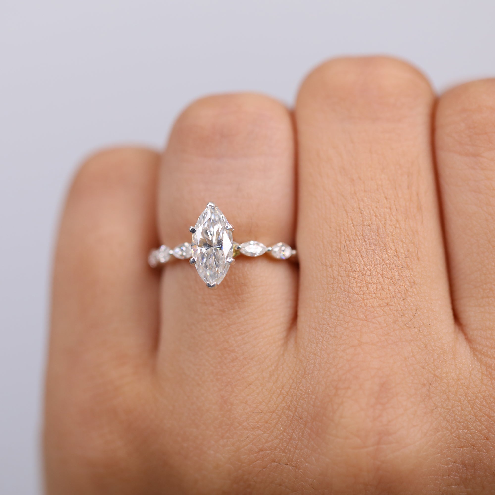 Luxury marquise diamond ring with marquise-accented white gold band