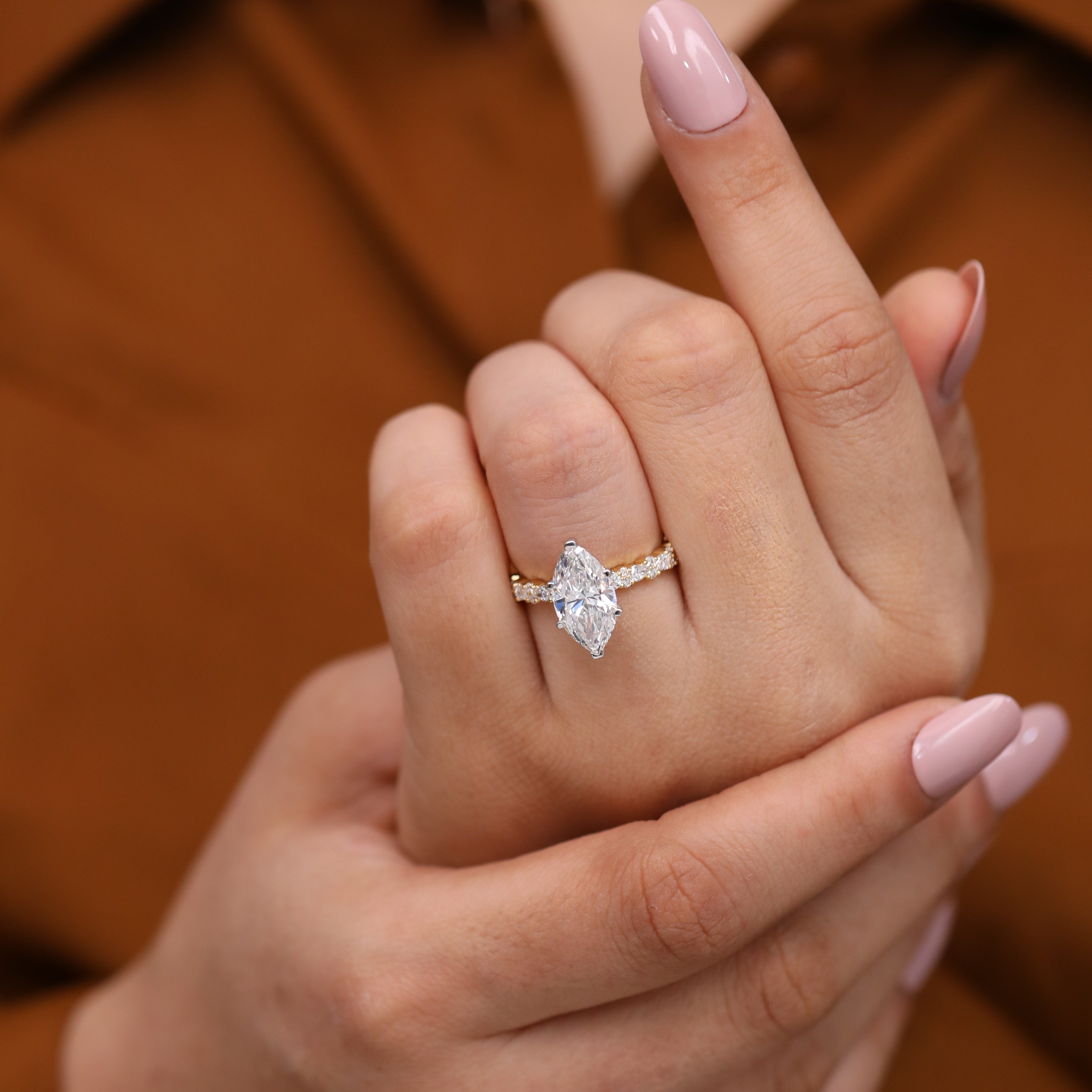 Fine jewelry engagement ring showcasing a marquise lab-grown diamond center