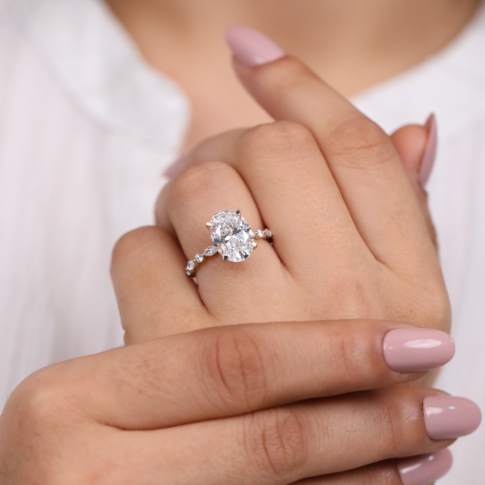 Luxury oval lab grown diamond solitaire ring with marquise and round accent stones