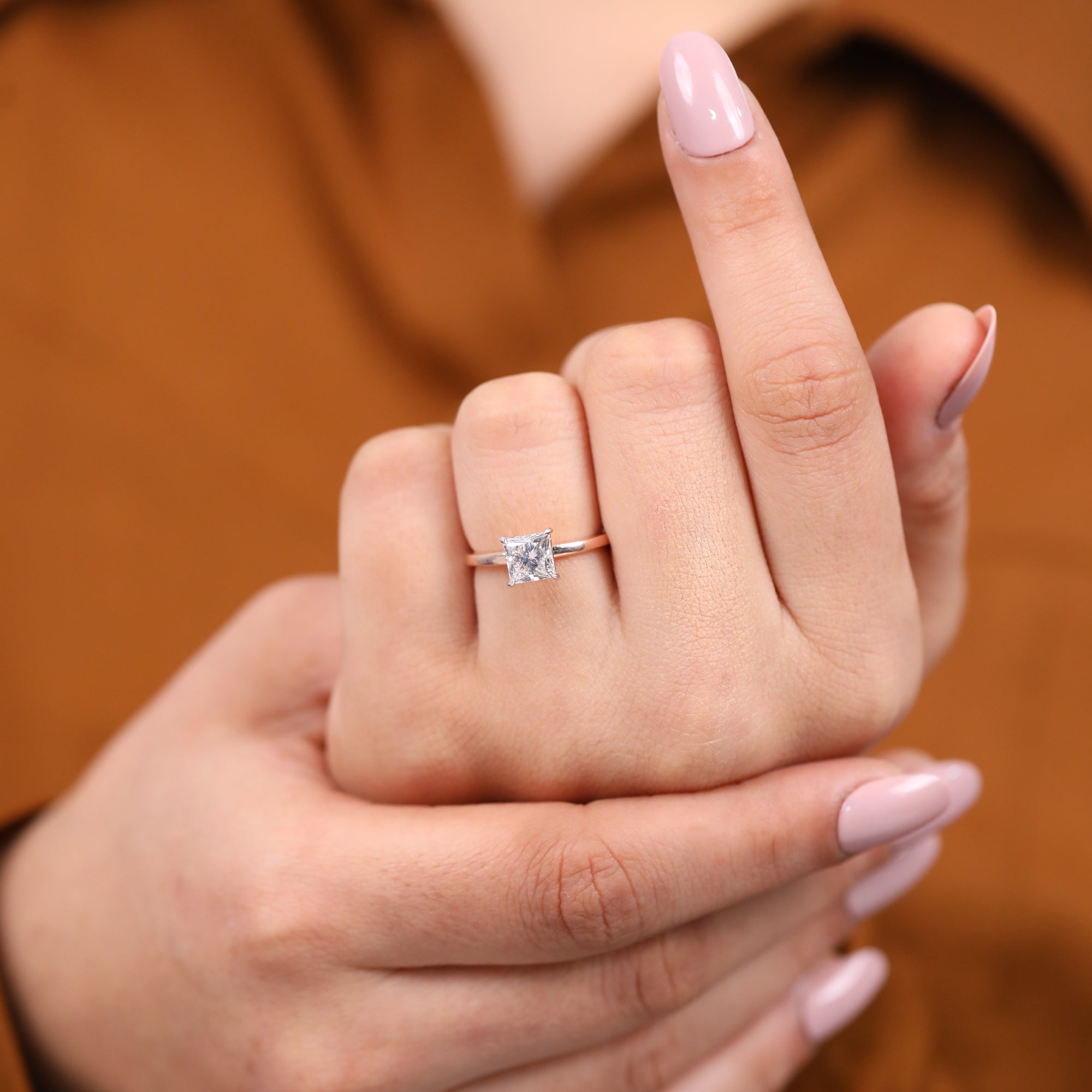 Modern solitaire engagement ring with a princess cut lab grown diamond
