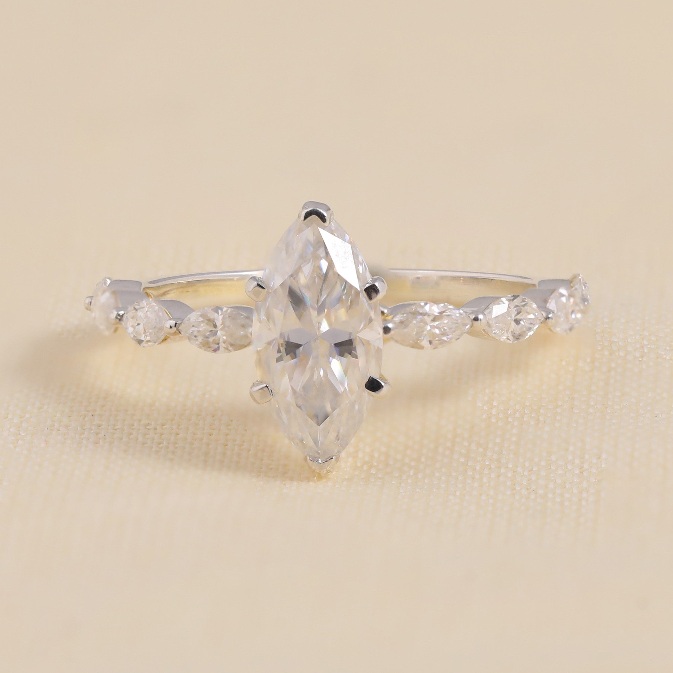 Marquise-cut diamond engagement ring with marquise side stones in white gold