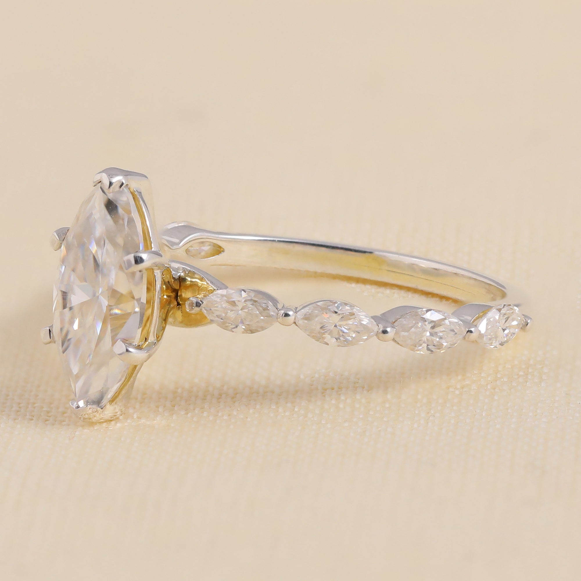 Vintage-inspired marquise diamond engagement ring with marquise-shaped accents