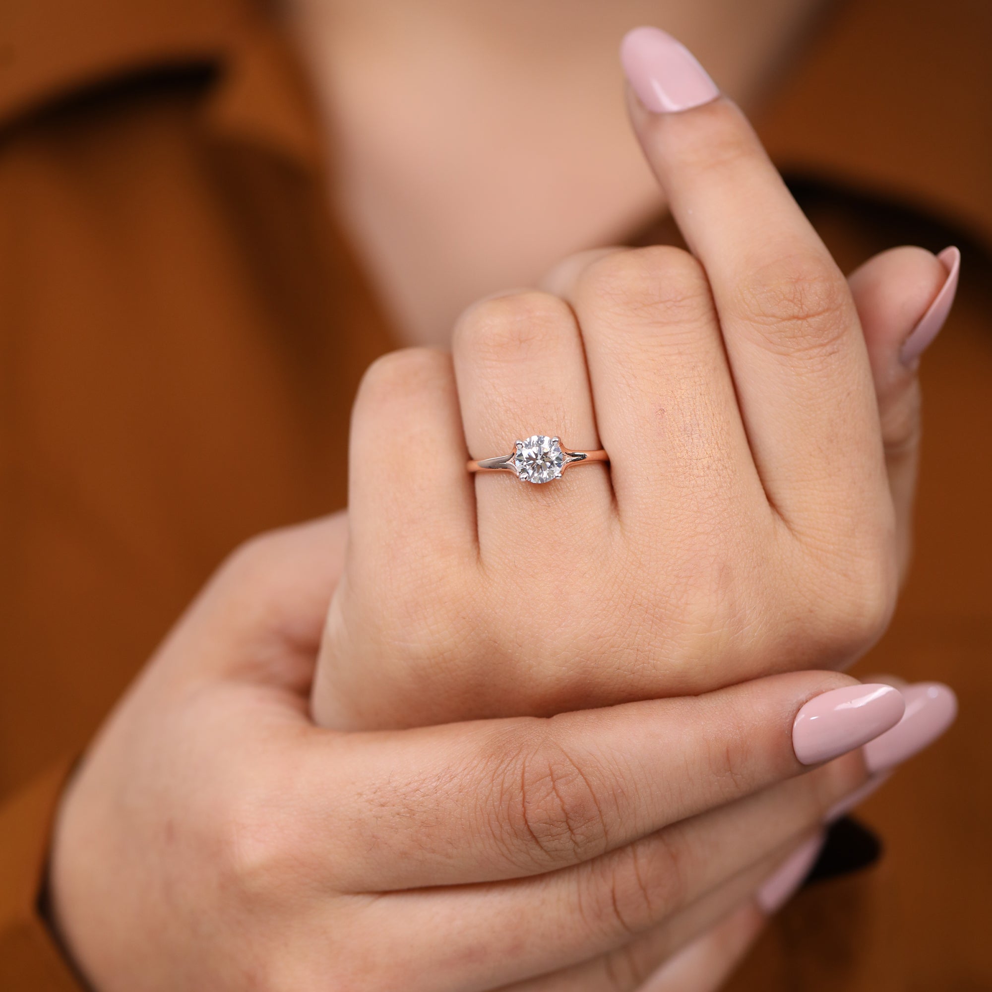 Delicate band solitaire ring holding a sparkling round lab-grown diamond