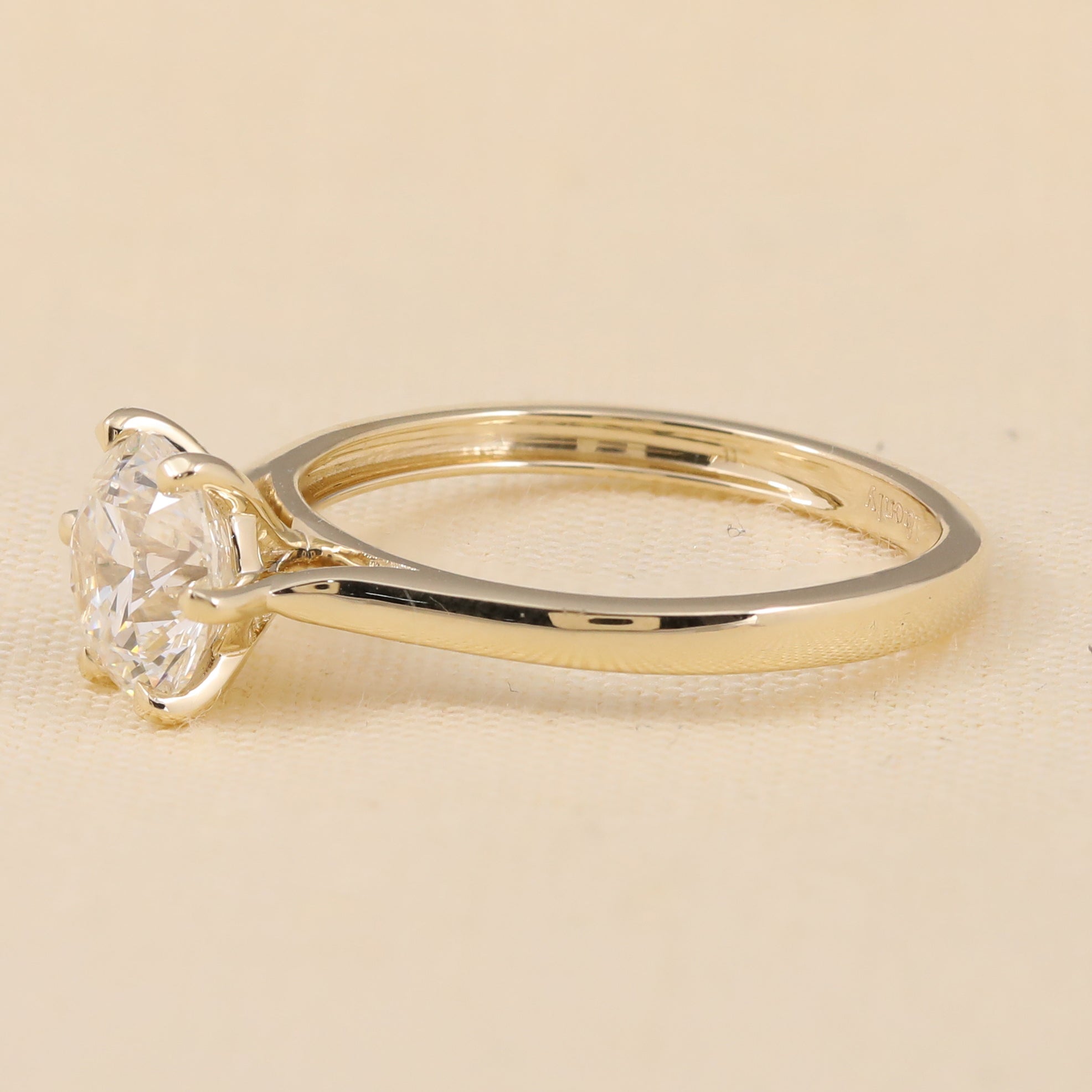 Elegant lab grown diamond solitaire ring featuring a brilliant round cut center stone