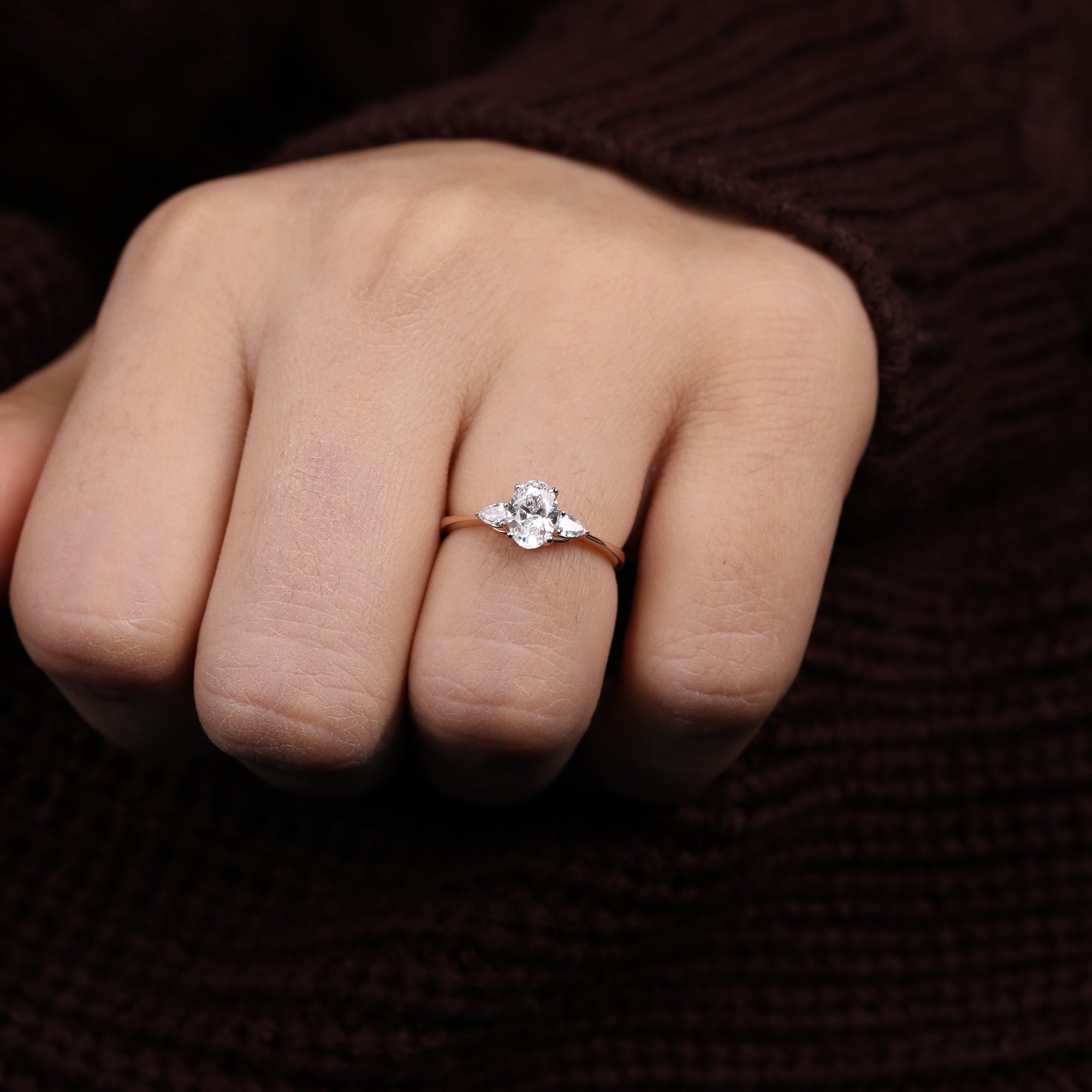 Oval center lab-grown diamond ring paired with pear shaped lab diamond accents
