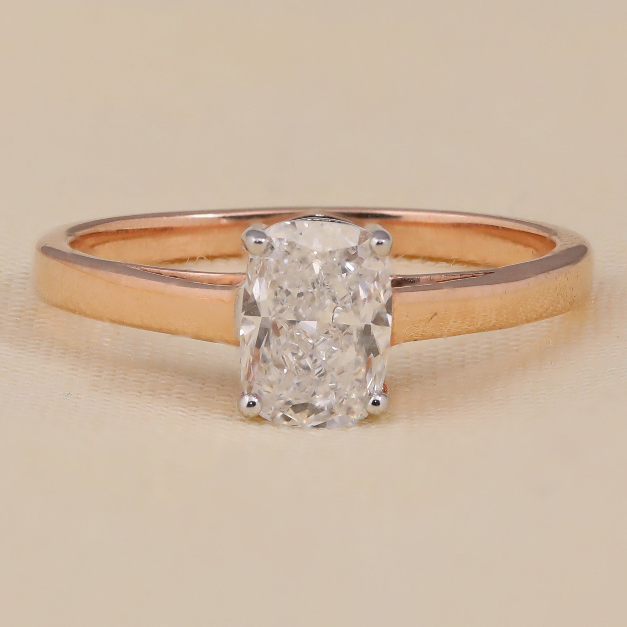 Rose gold solitaire ring with cushion cut lab grown diamond in a four prong setting