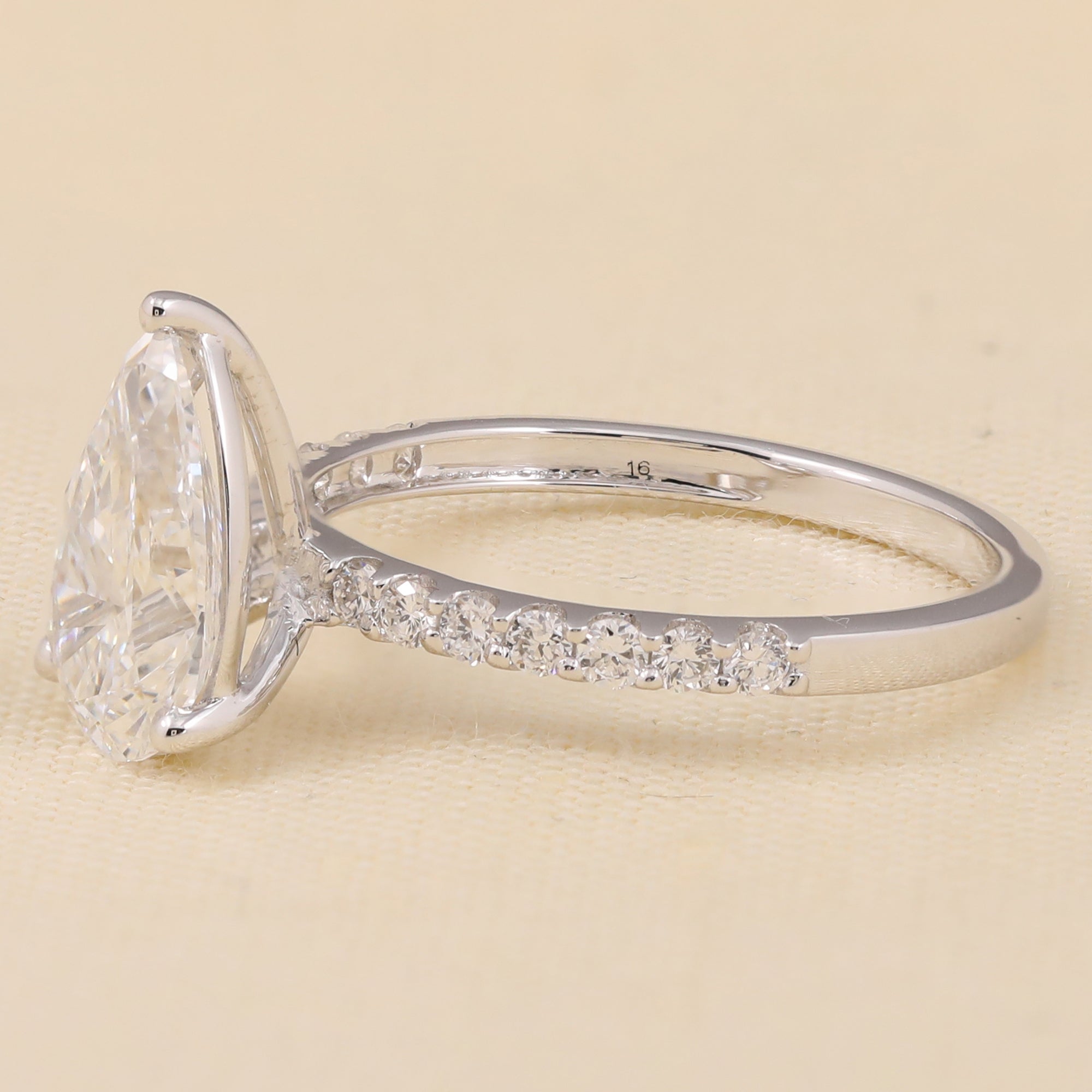 Elegant pear-cut lab-grown diamond ring featuring a pavé lab diamond shank